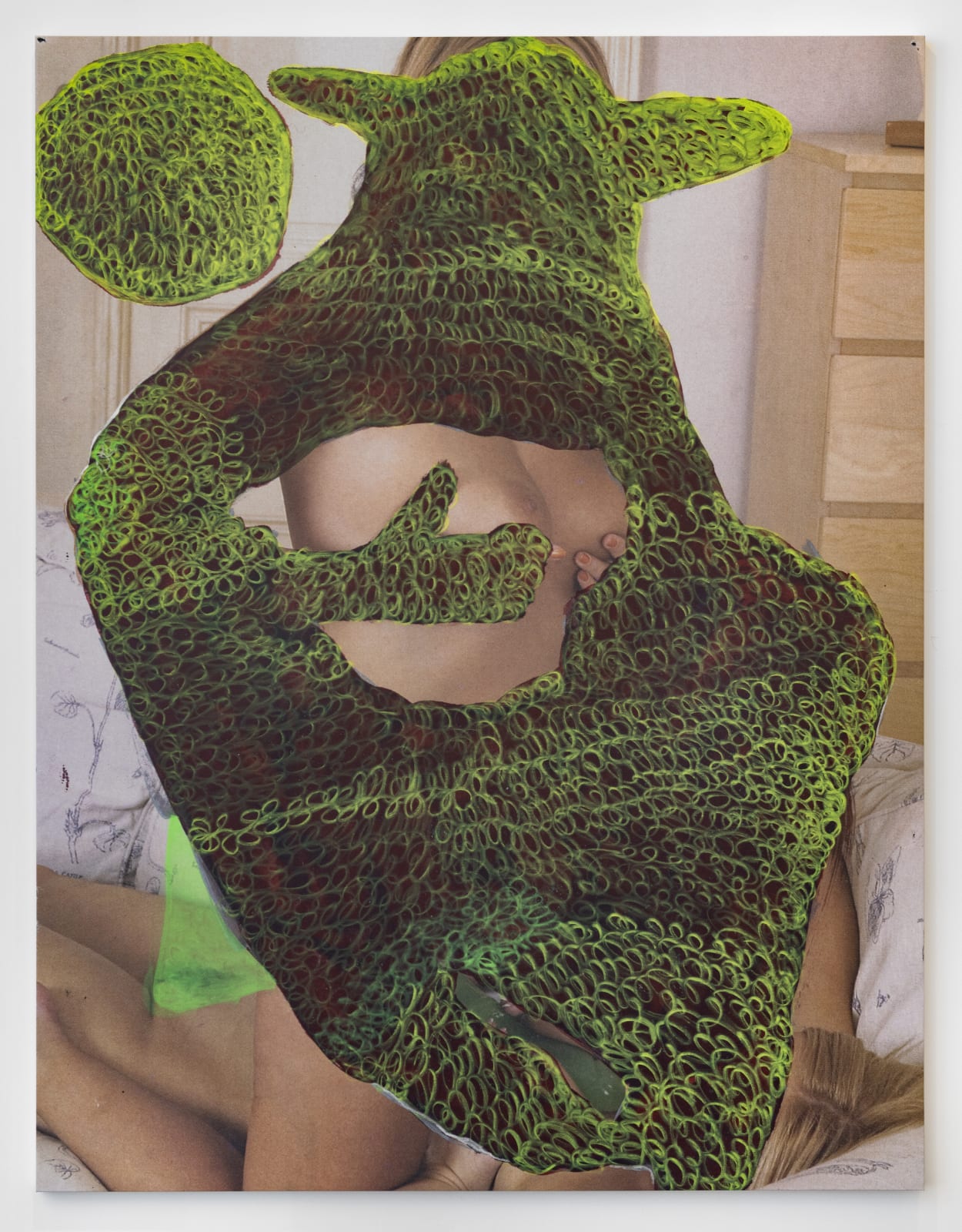 A pornographic image strategically covered with green ink gestures