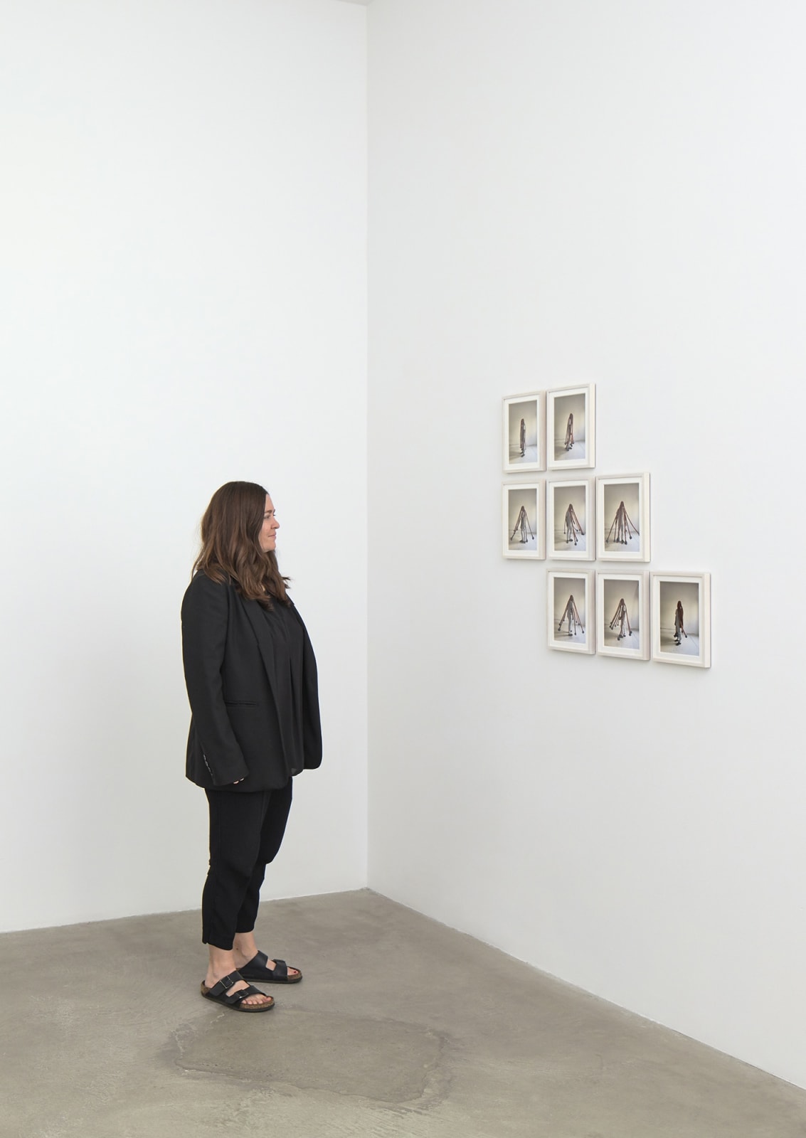 Photo series of Neto wearing sculpture