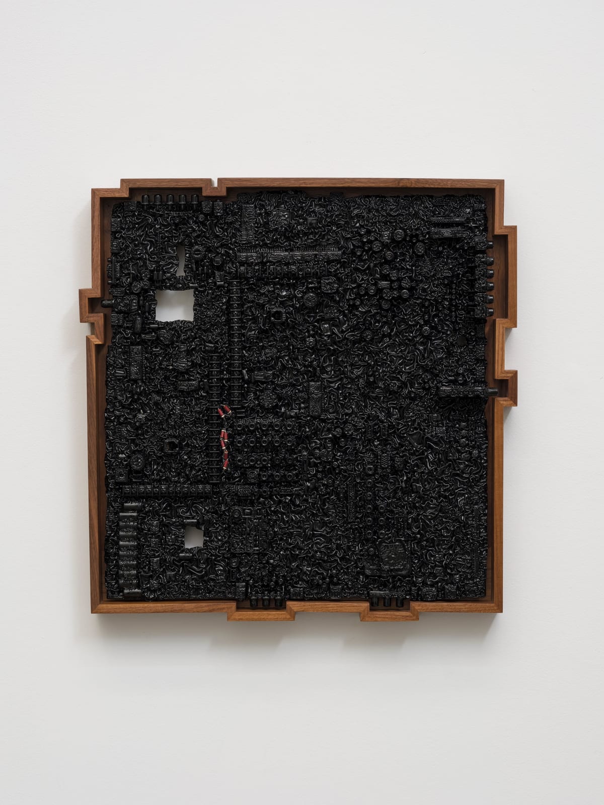 an ink of computer circuit board sculpture on a white wall