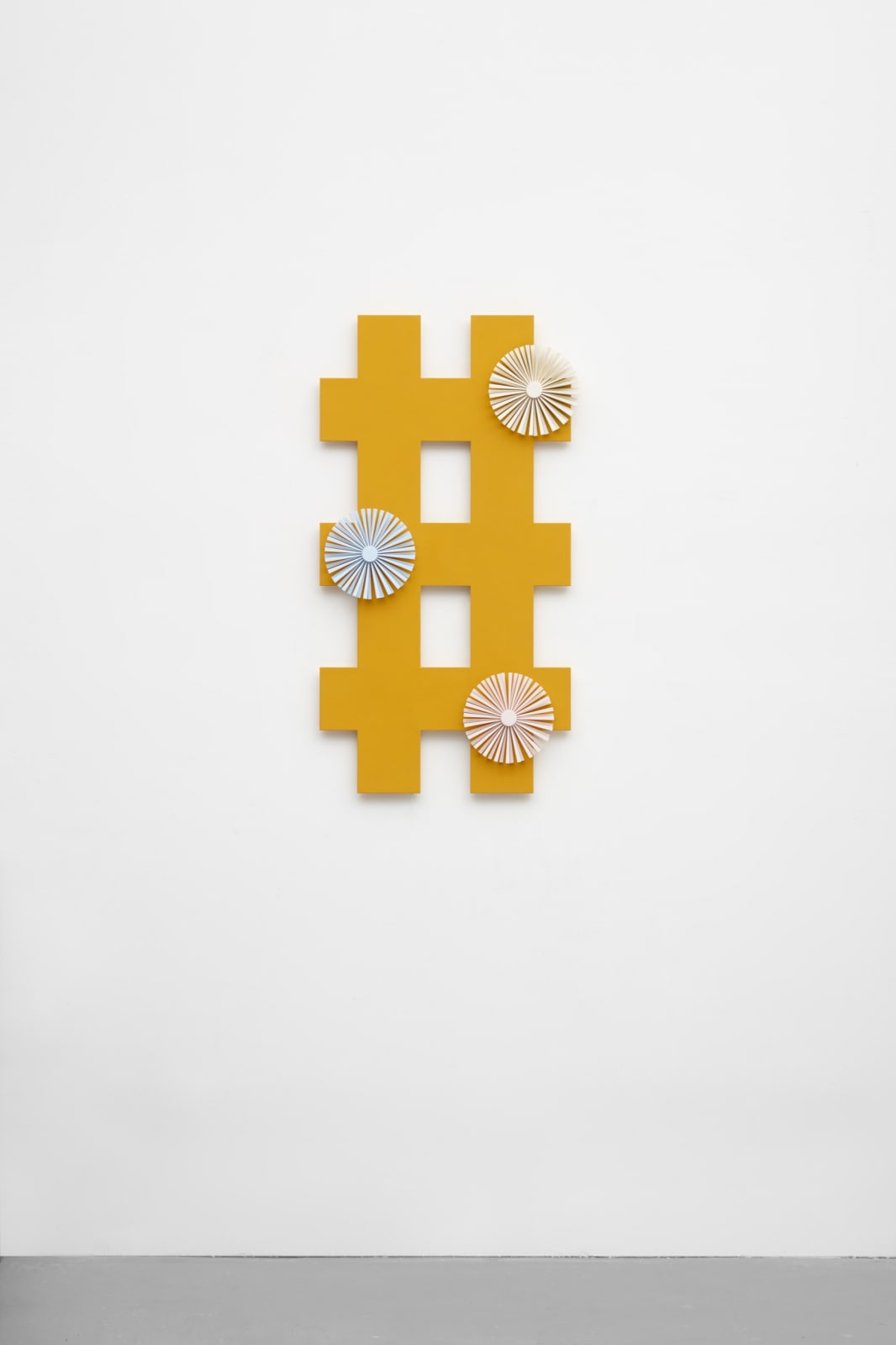 orange criss cross wall sculpture