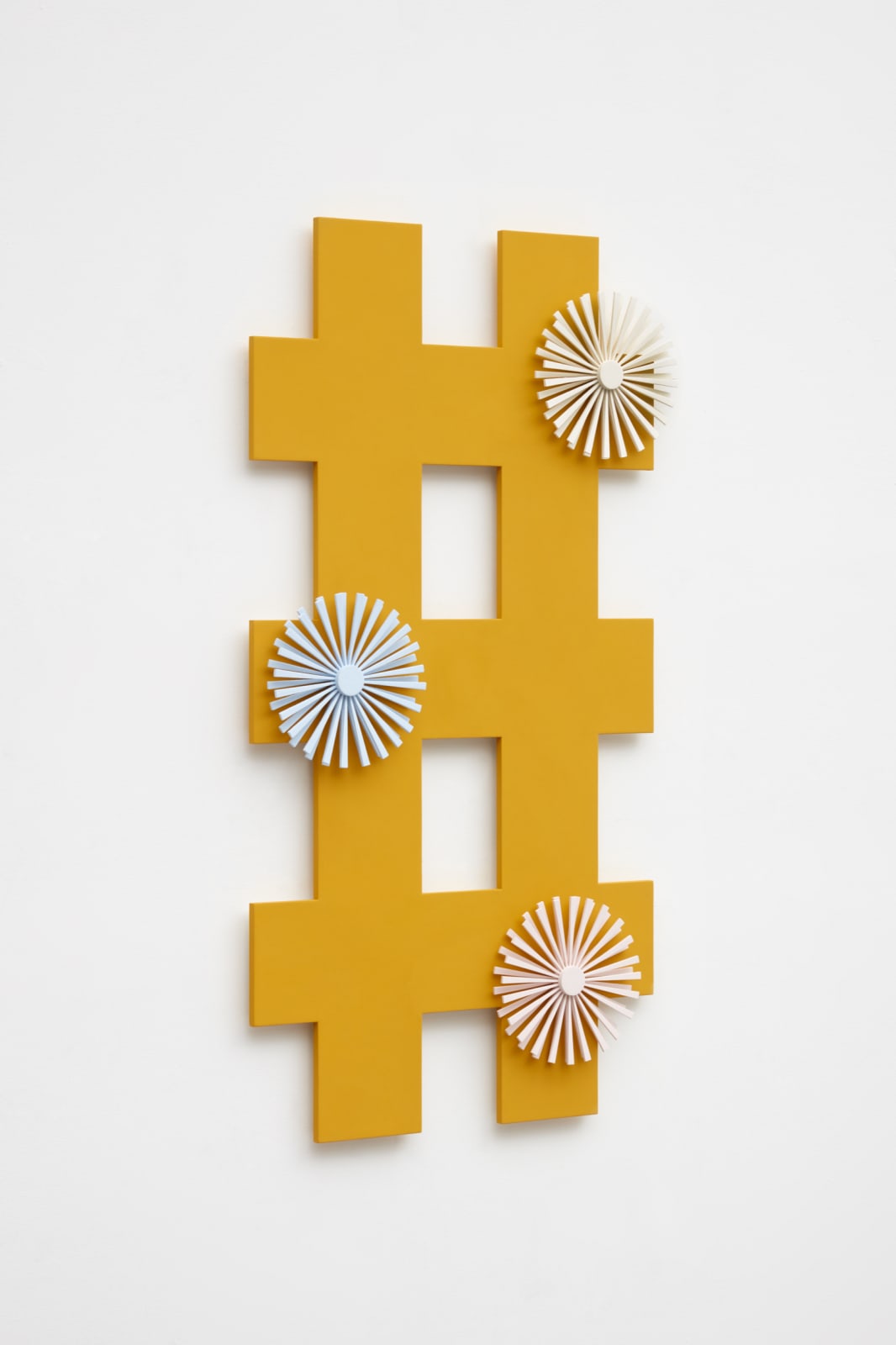 orange criss cross wall sculpture