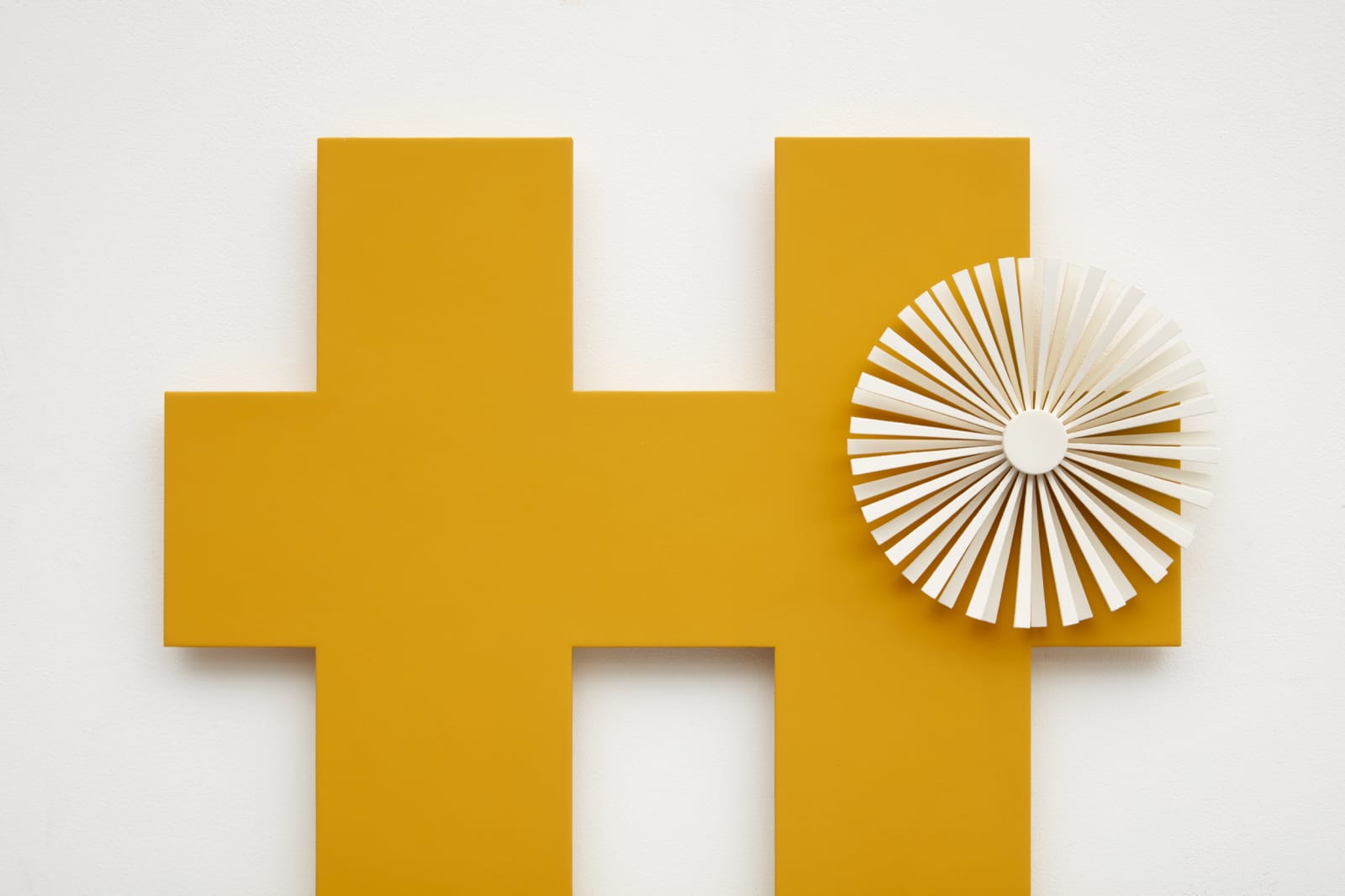 orange criss cross wall sculpture