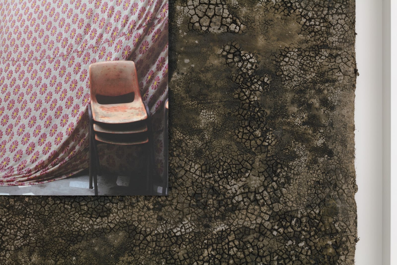 Karyn Olivier's Welcome (Accra), a detail view of a framed sculptural artwork with a photographic print and roofing layered on top against a white wall