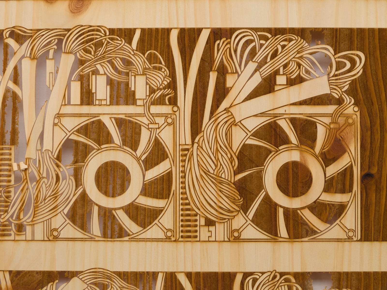 a detail of a laser sculpted wood sculpture on a white wall