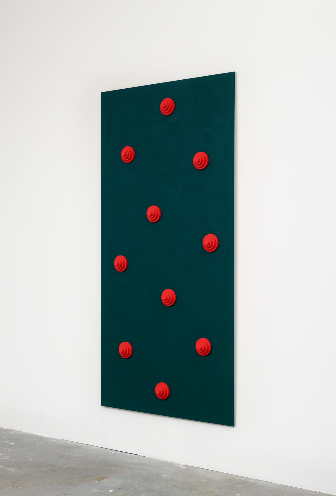 Green board with red circular objects
