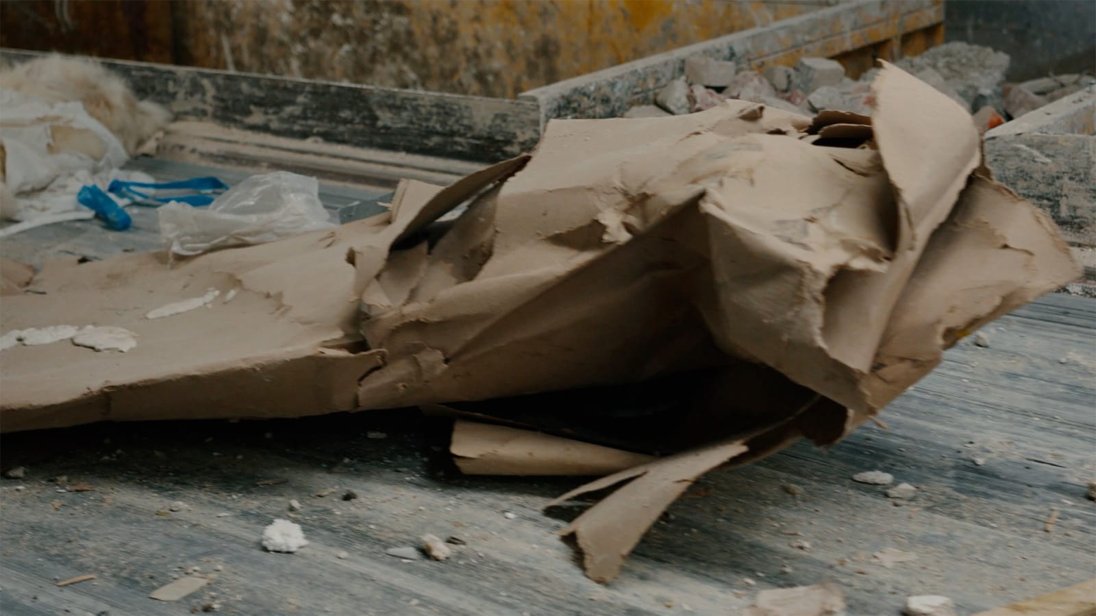 Karyn Olivier's Drift (Tributary), a video still of recyclables and debris on a conveyer belt