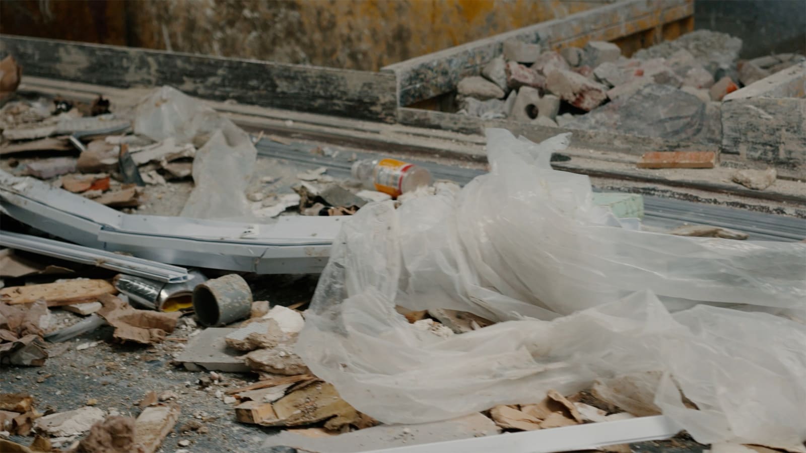 Karyn Olivier's Drift (Tributary), a video still of recyclables and debris on a conveyer belt