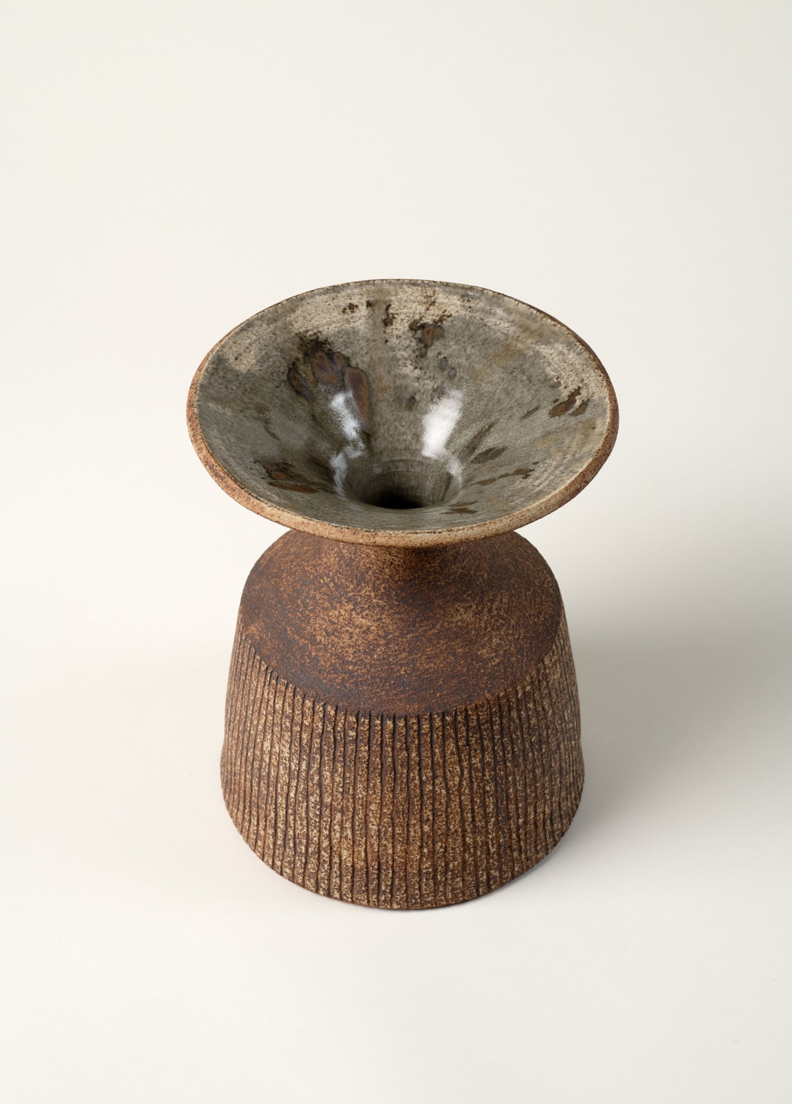 Waistel Cooper, Mallet form vase with wide flared rim and cut shoulders