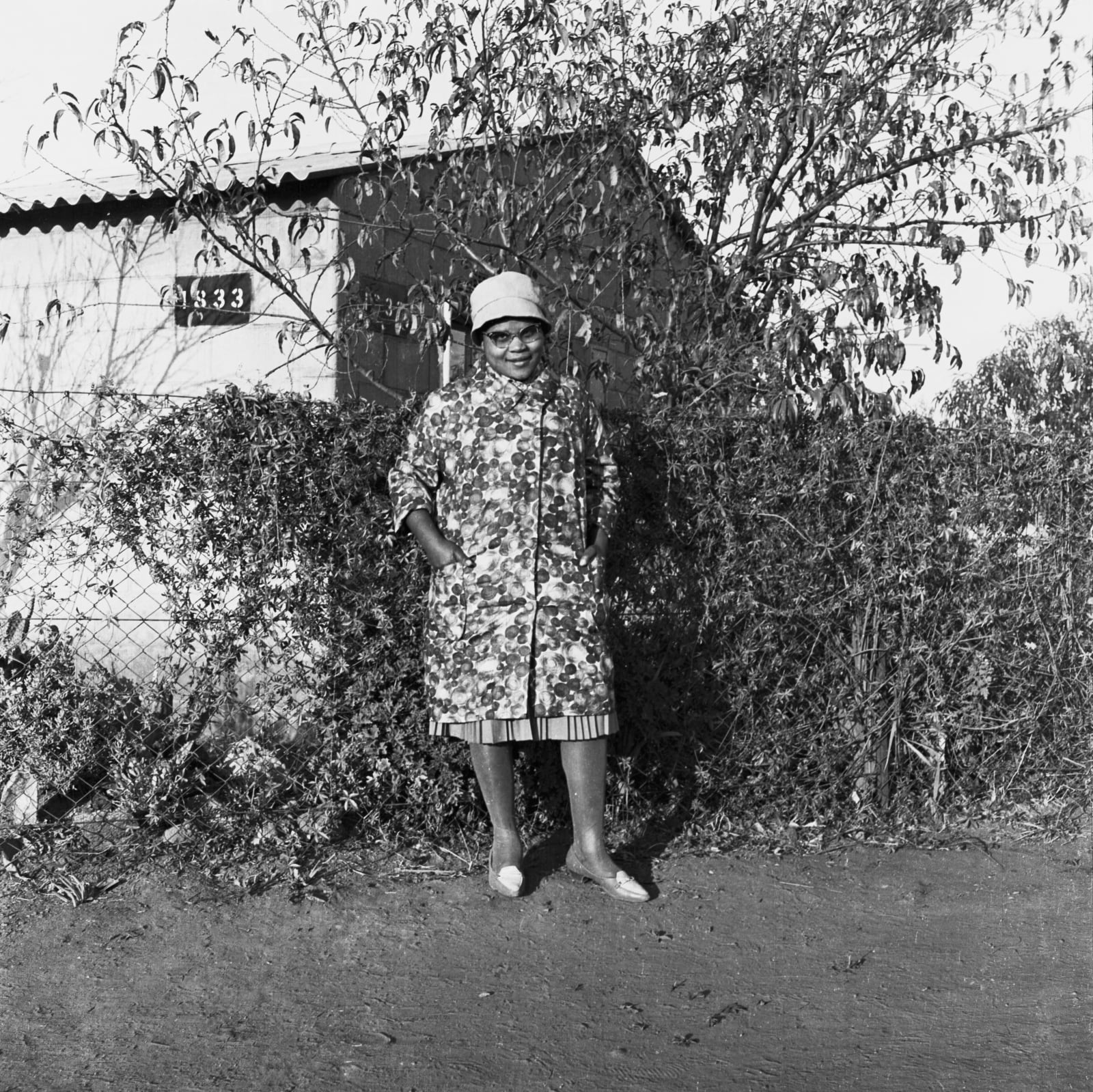 Ronald Ngilima, Portrait of a woman in front of her home, Wattvile, circa 1950