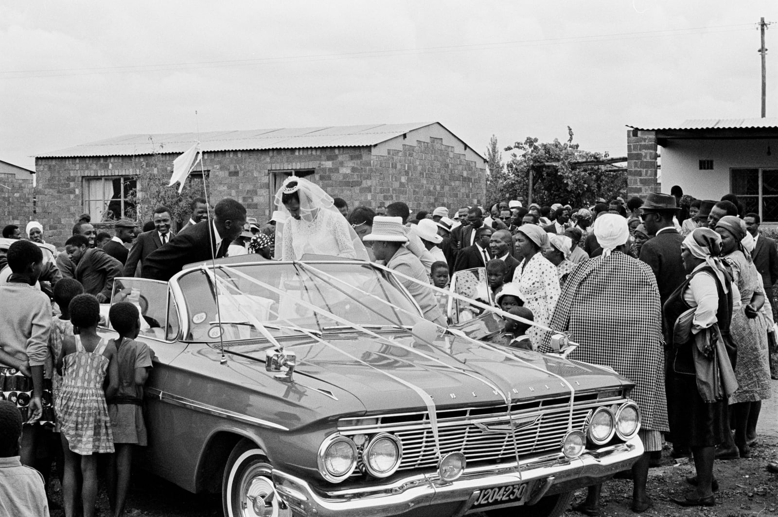 Ernest Cole, Rented cars are a status symbol at middle-class marriages. Expensive weddings can leave couples broke for a year, circa 1965