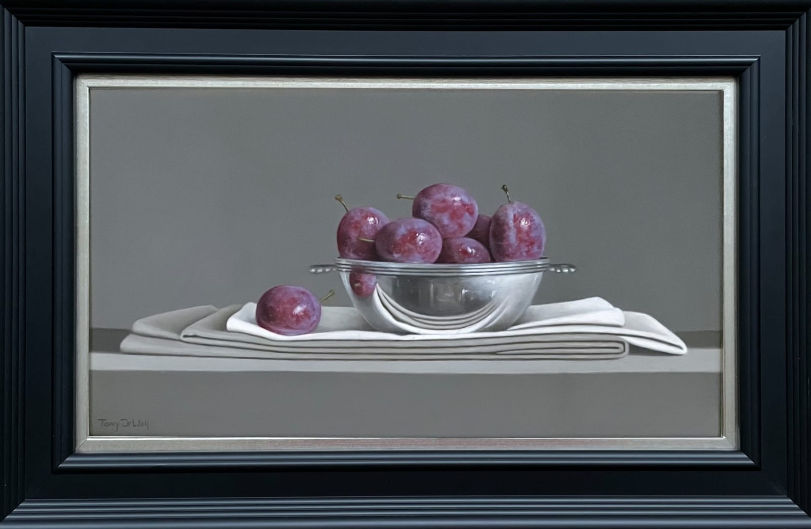 Tony de Wolf, Blue Plums in Silver Bowl on folded Linen