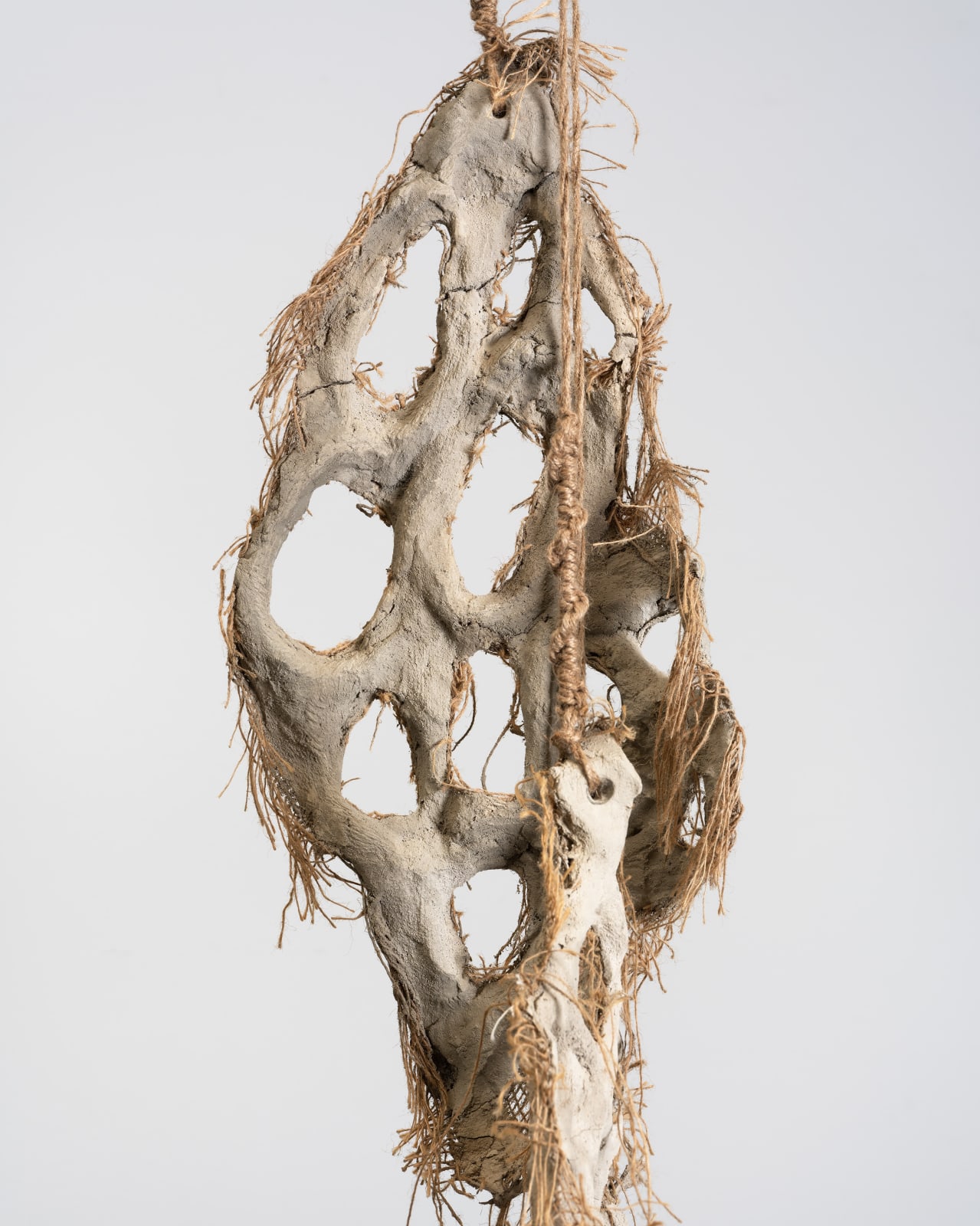 Mire Lee, Untitled (hanging burlap piece with many holes), 2022–2023