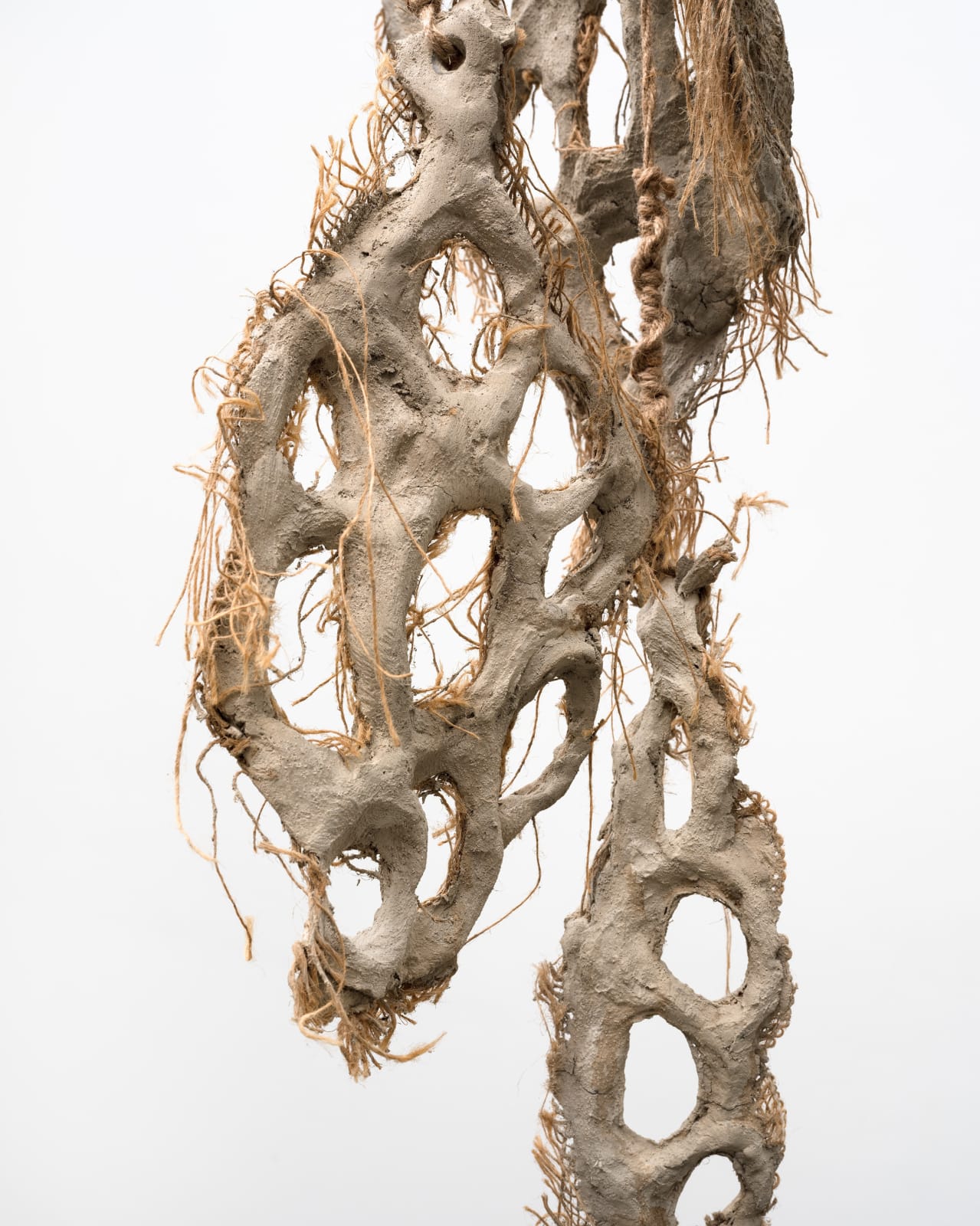 Mire Lee, Untitled (hanging burlap piece with many holes), 2022–2023