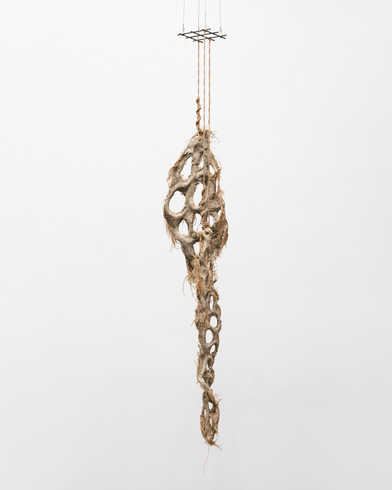 Mire Lee, Untitled (hanging burlap piece with many holes), 2022–2023