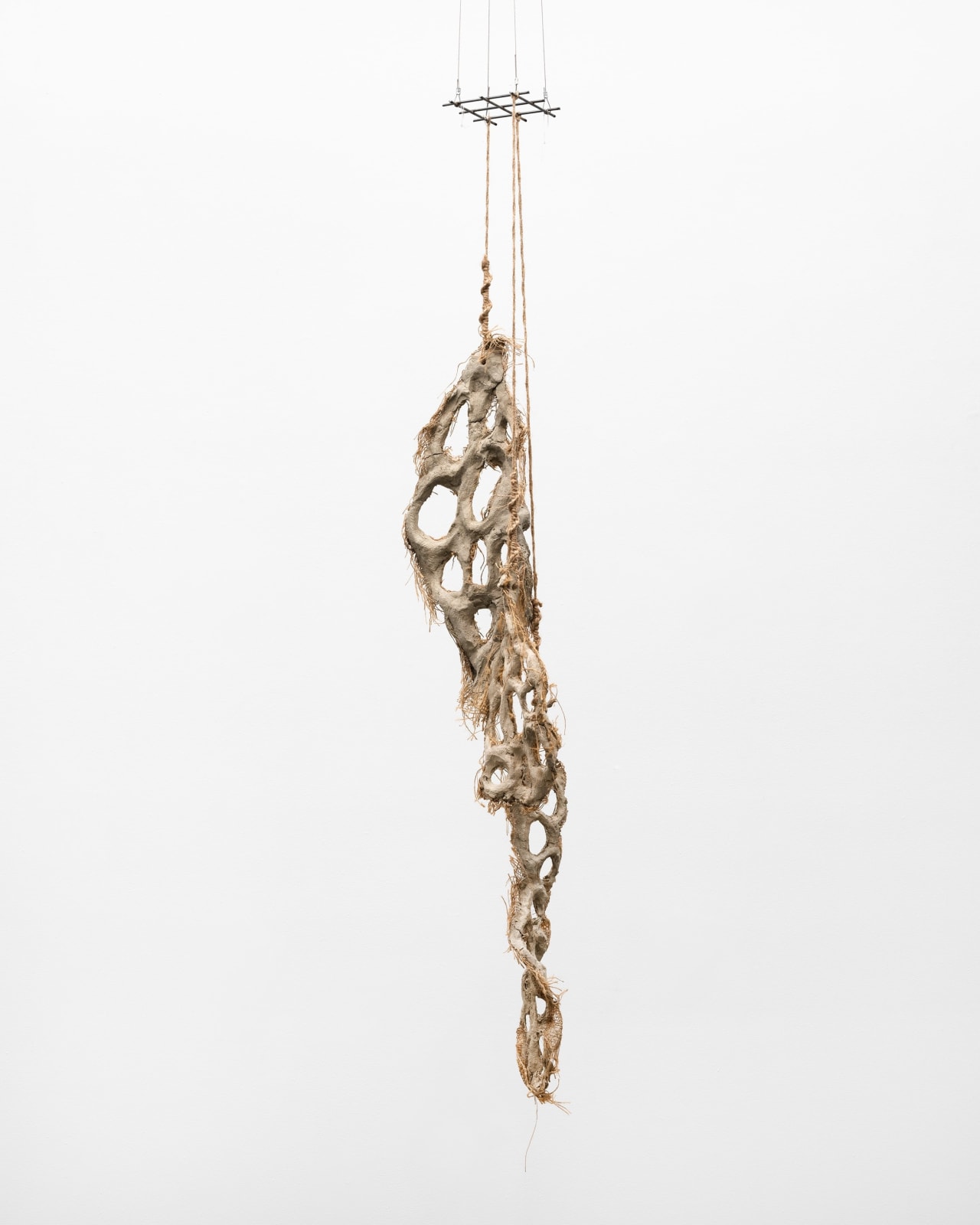 Mire Lee, Untitled (hanging burlap piece with many holes), 2022–2023