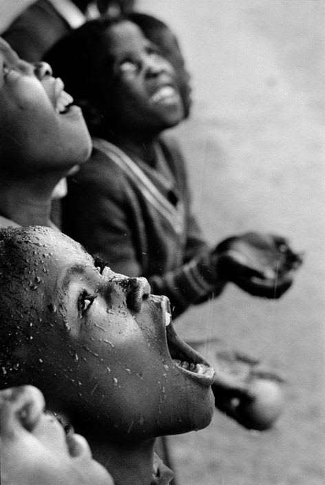 Chris Steele-Perkins, School children during a rainstorm, Lesotho, 1981