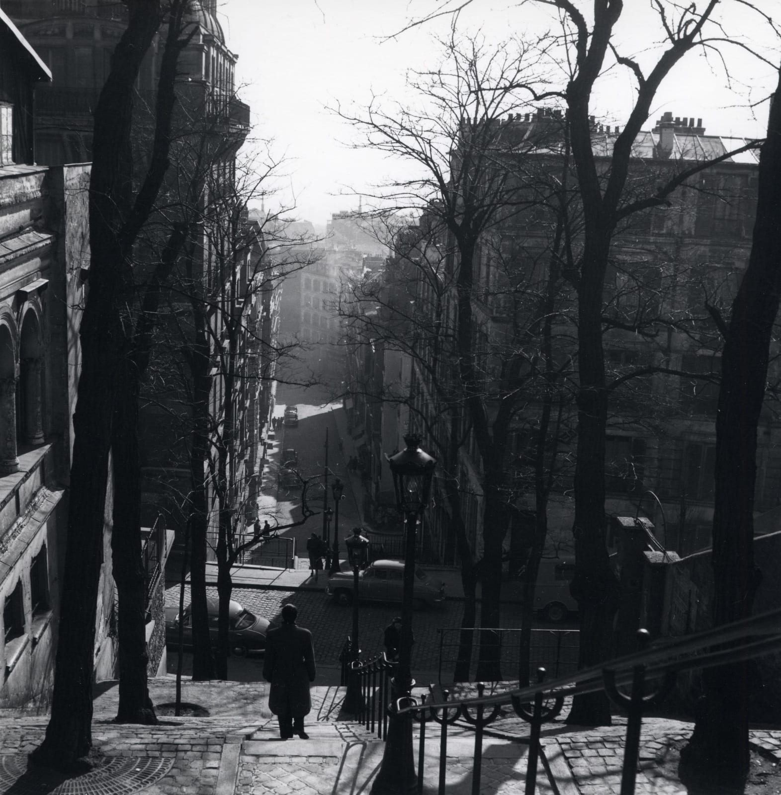 Dorothy Bohm, Montmartre, Paris [man on steps], 1953