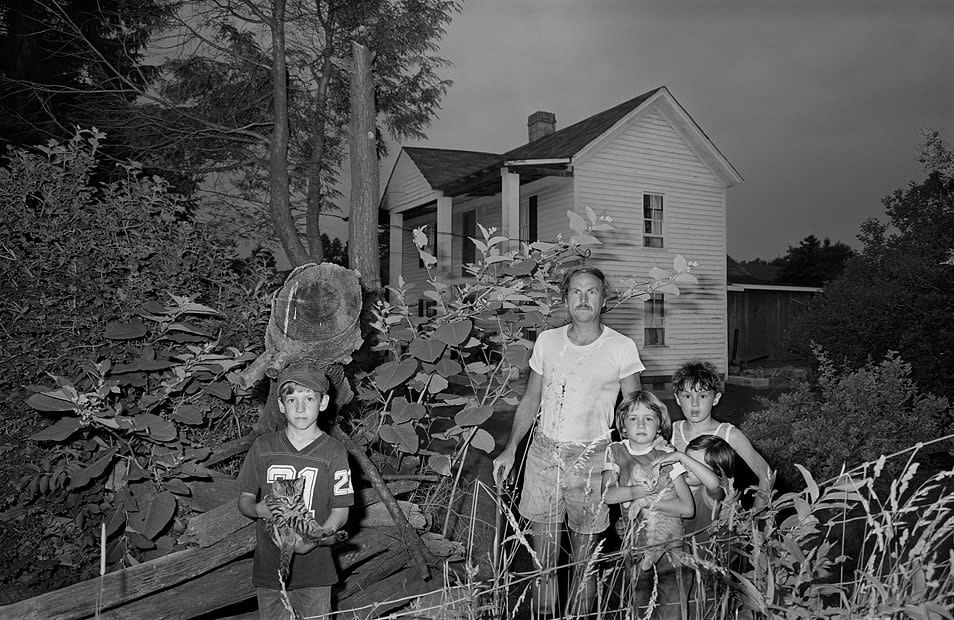 Sage Sohier, Family holding cats at dusk, Cool Ridge, West Virginia, 1982