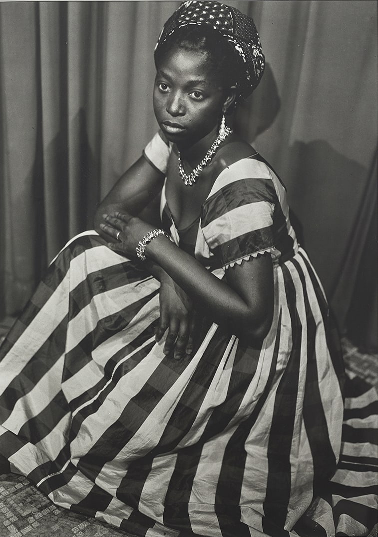 Seydou Keïta, Young woman wearing a black and white striped dress, 1952