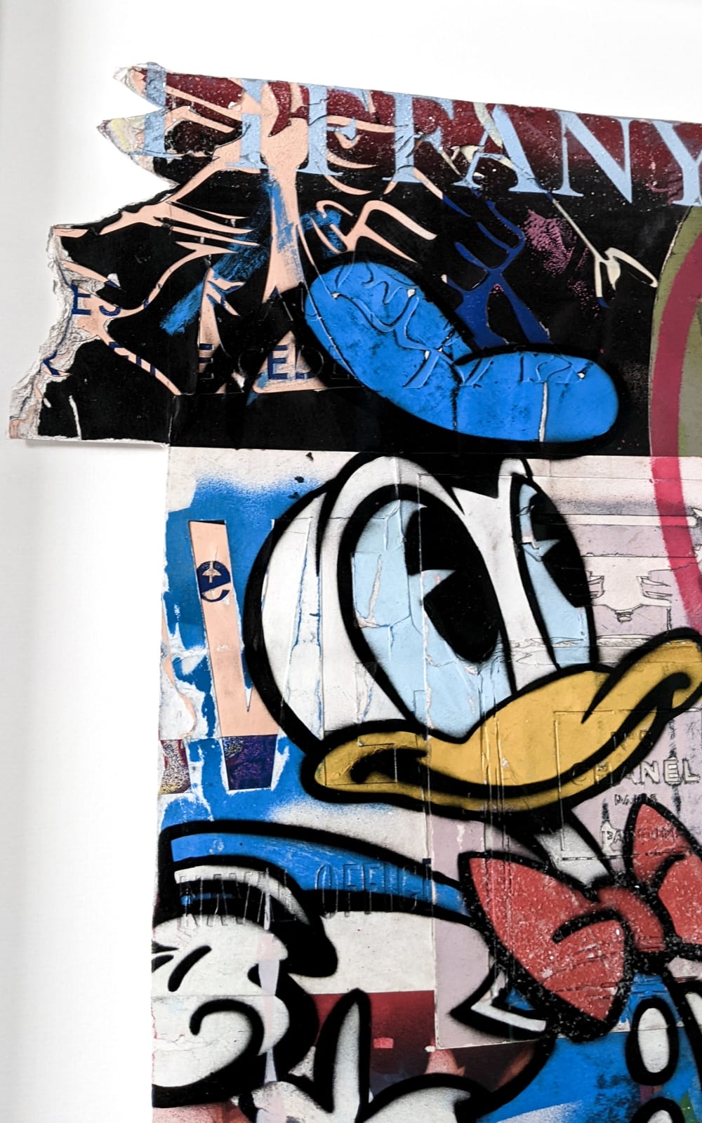 lhouette artist using collage acrylic diamond dust featuring Disney characters like Donald duck with orange blue white red brown colours