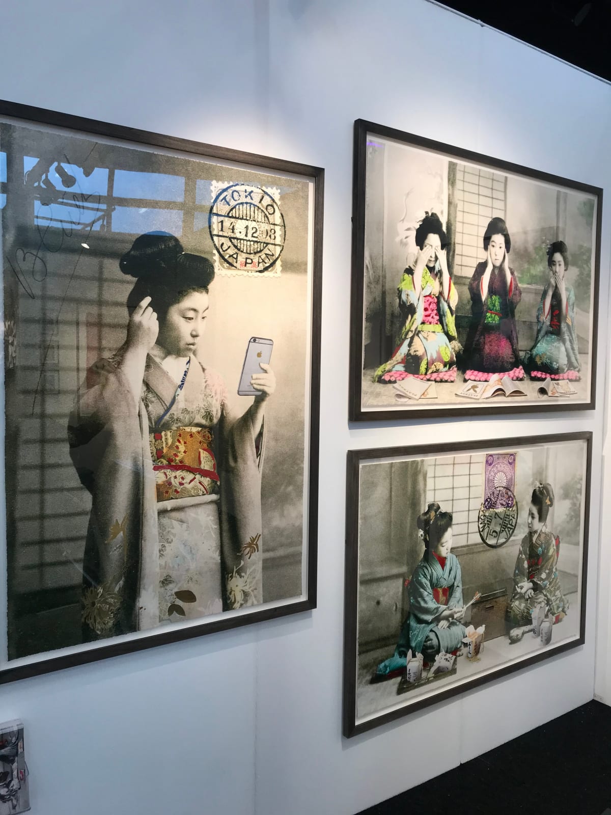 Framed Geisha Girls prints hung on wall