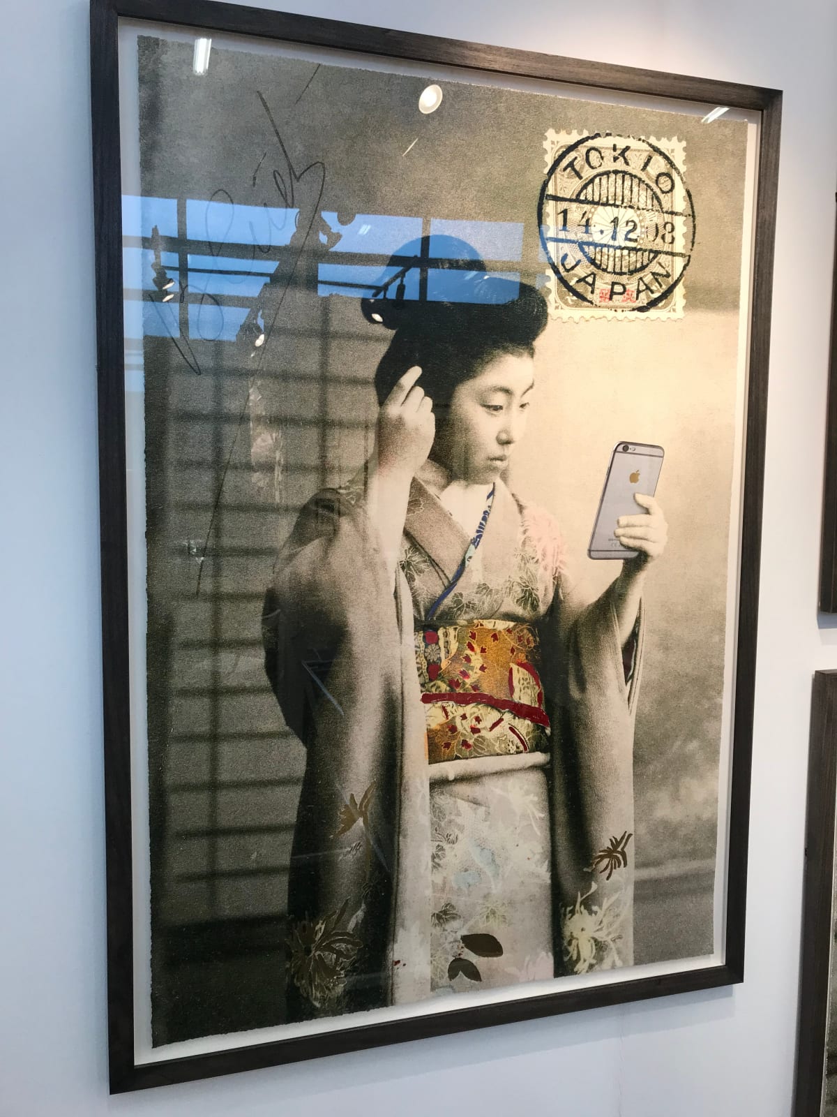 Geisha Girl holding iPhone framed