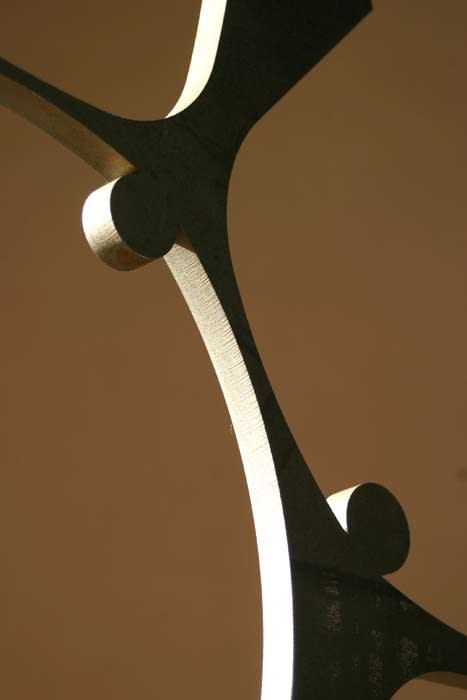 Mild steel mother and child sculpture on plinth