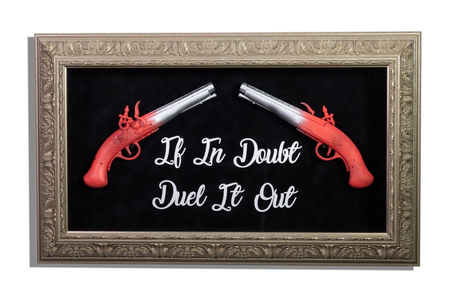 Red & silver duelling pistols in gold frame