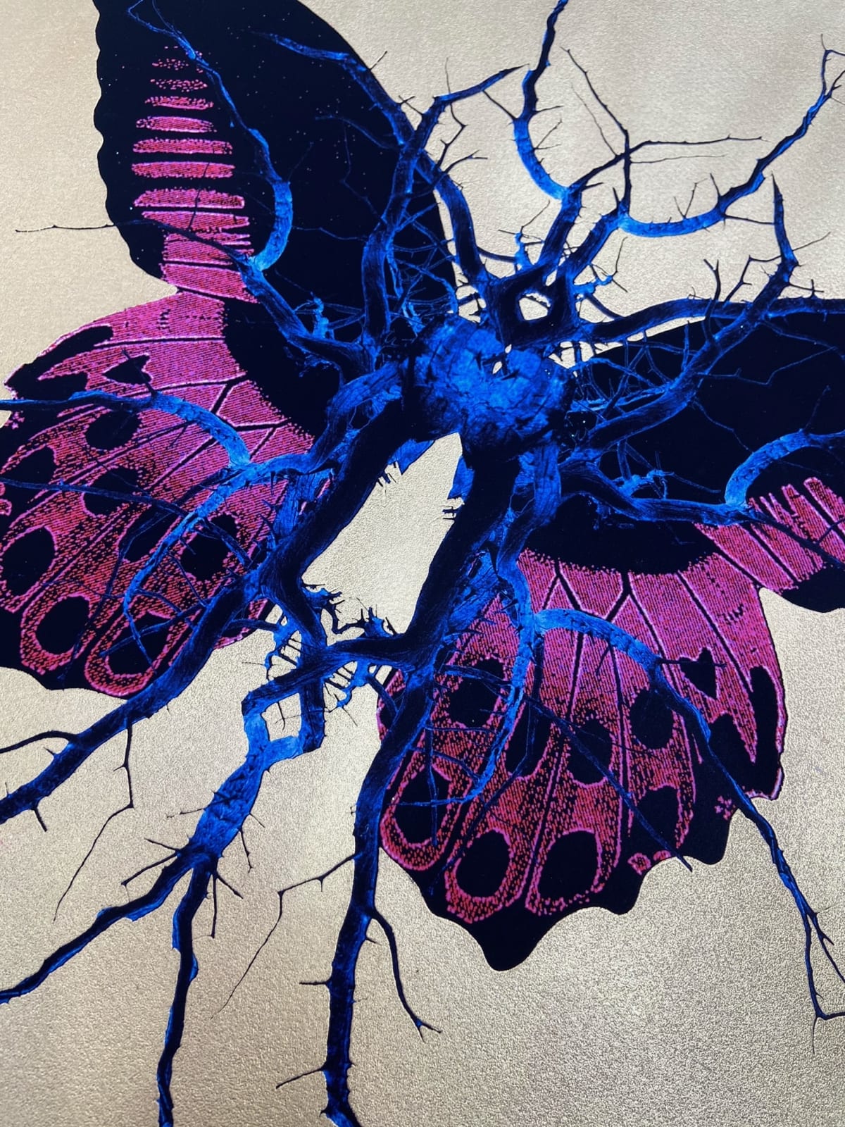 Purple, black & blue electric butterfly on gold leaf background circular background