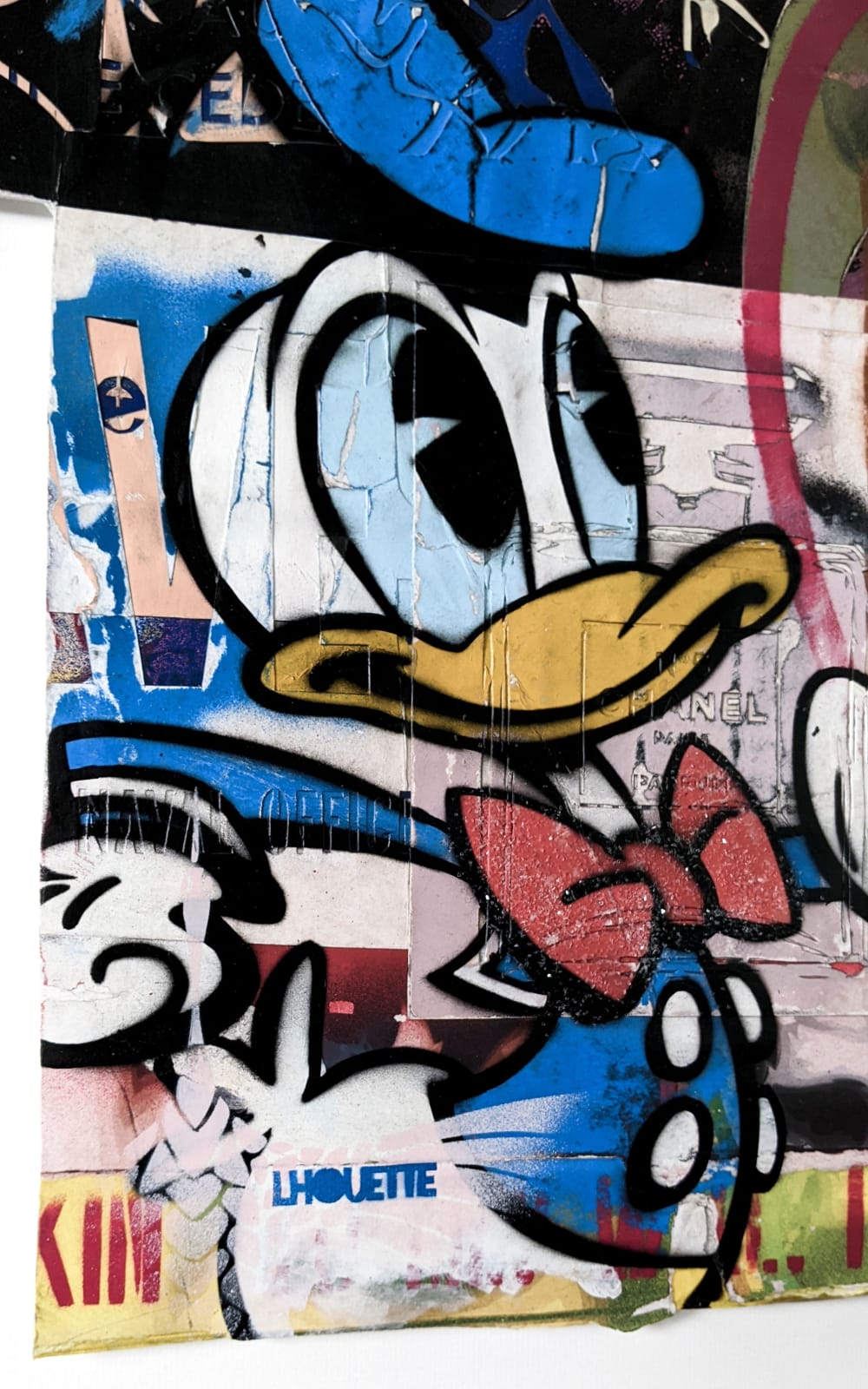 lhouette artist using collage acrylic diamond dust featuring Disney characters like Donald duck with orange blue white red brown colours