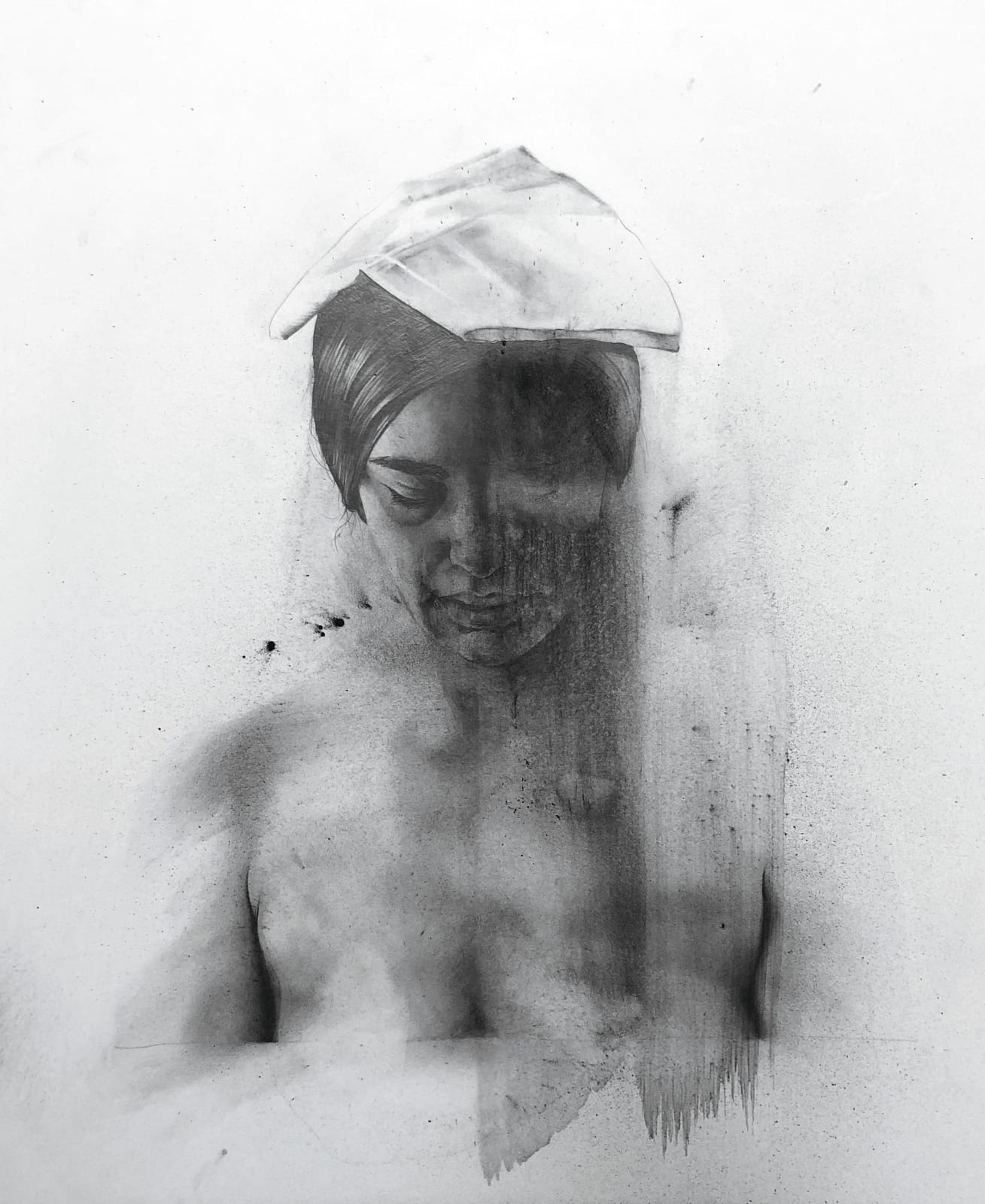 Charcoal portrait of woman looking down
