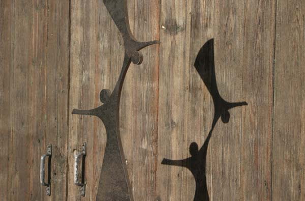 Mild steel mother and child sculpture on plinth