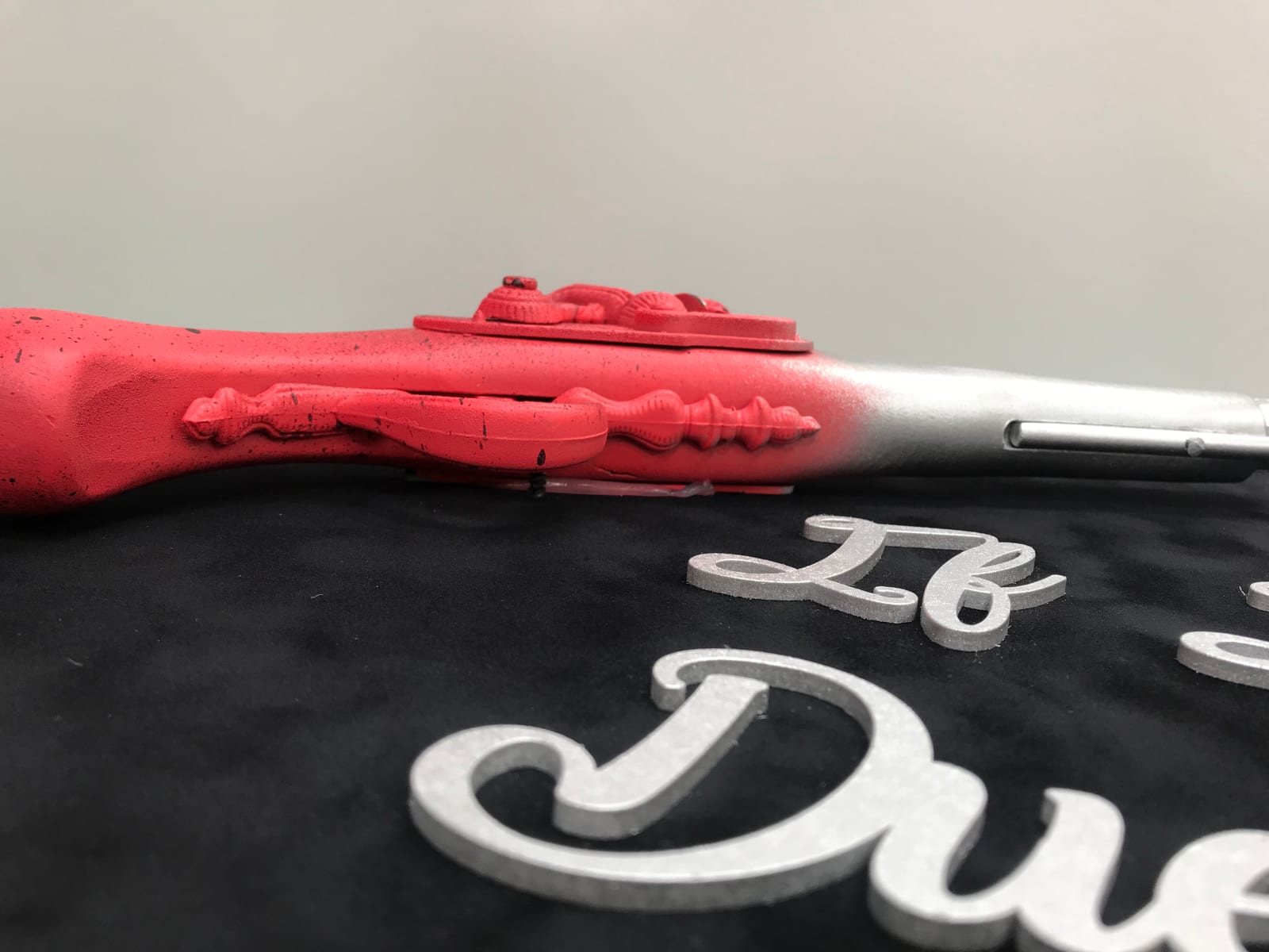 Red & silver duelling pistols