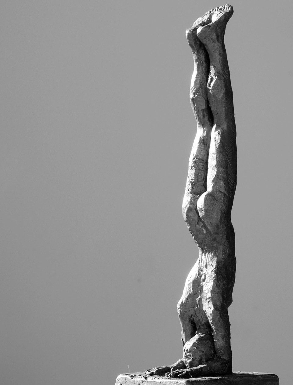 Iron resin sculpture doing a handstand