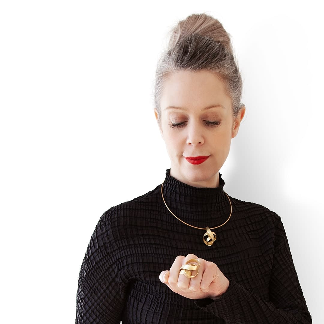 Sculptural ring and pendant – curling crest of a wave – in 18 kt Fairtrade Gold by ethical jewellery artist Ute Decker