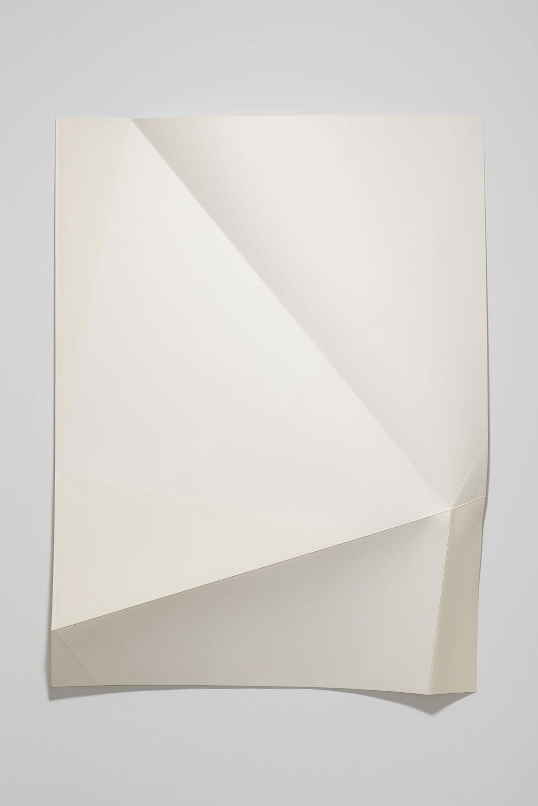 Series of white folded paper pieces