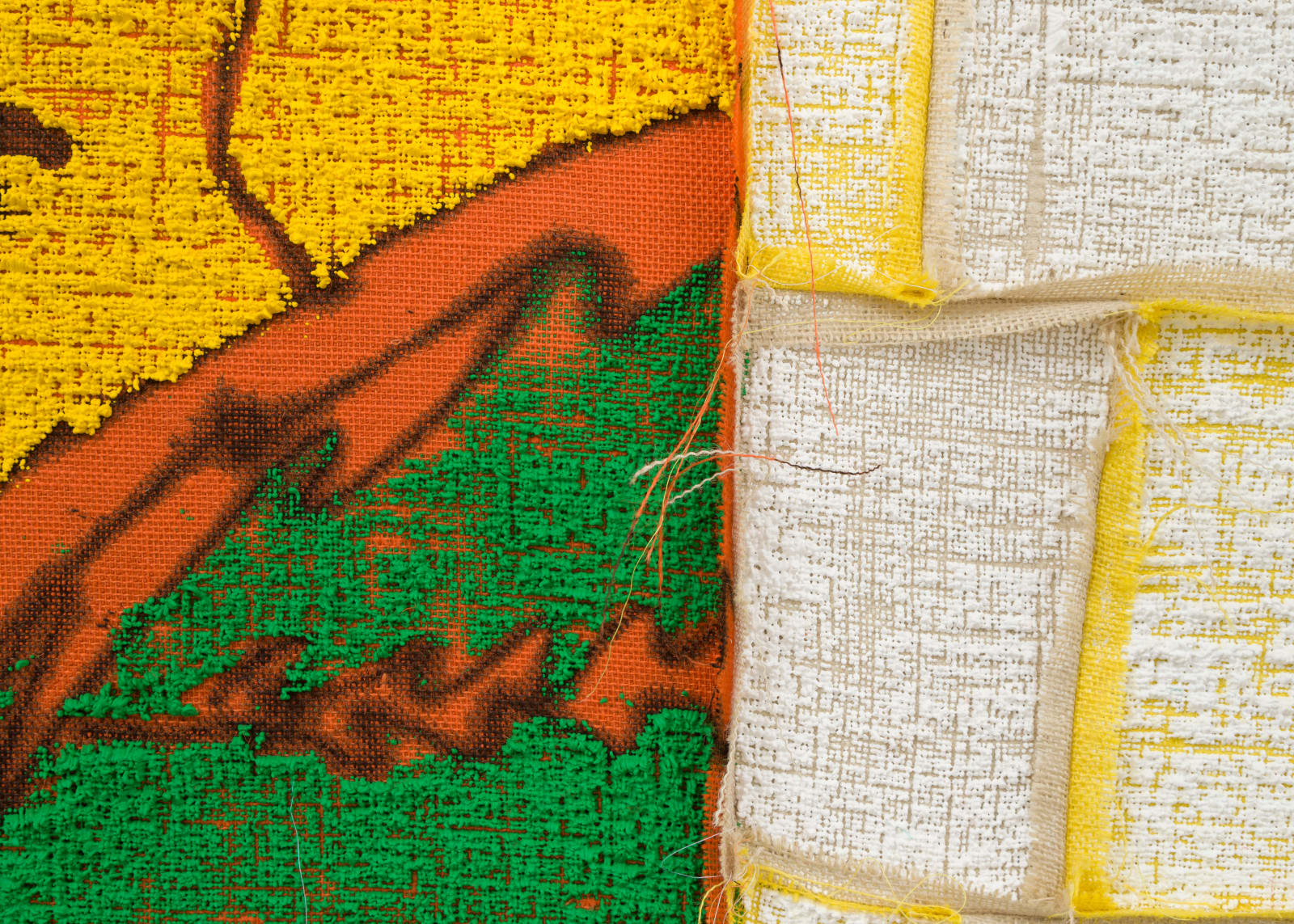 detail of green paint pushed through burlap