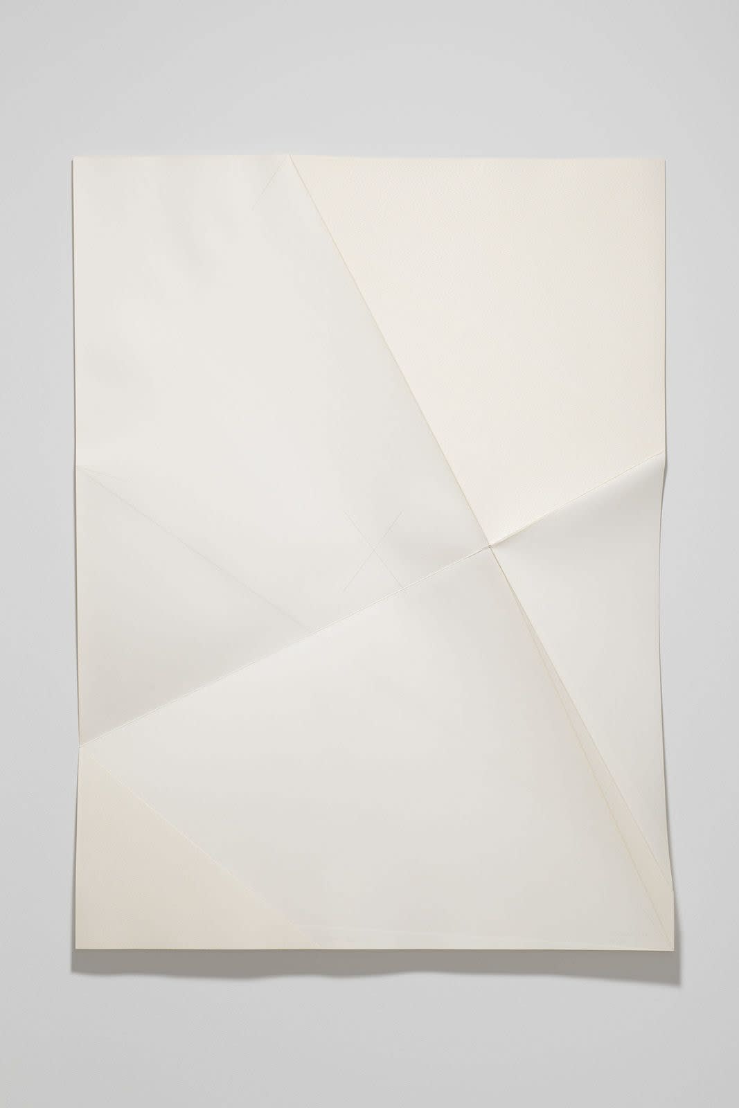 Series of white folded paper pieces