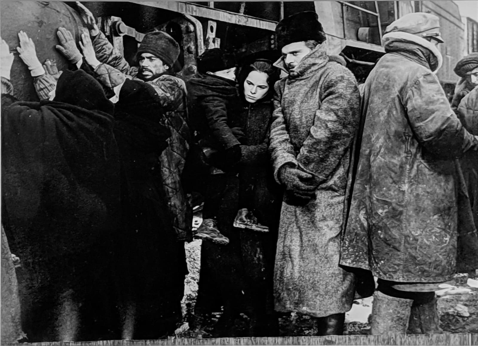 Black and white photograph of Geraldine Chaplin and director David Lean sitting at a desk and reviewing the script, on the set of “Doctor Zhivago”