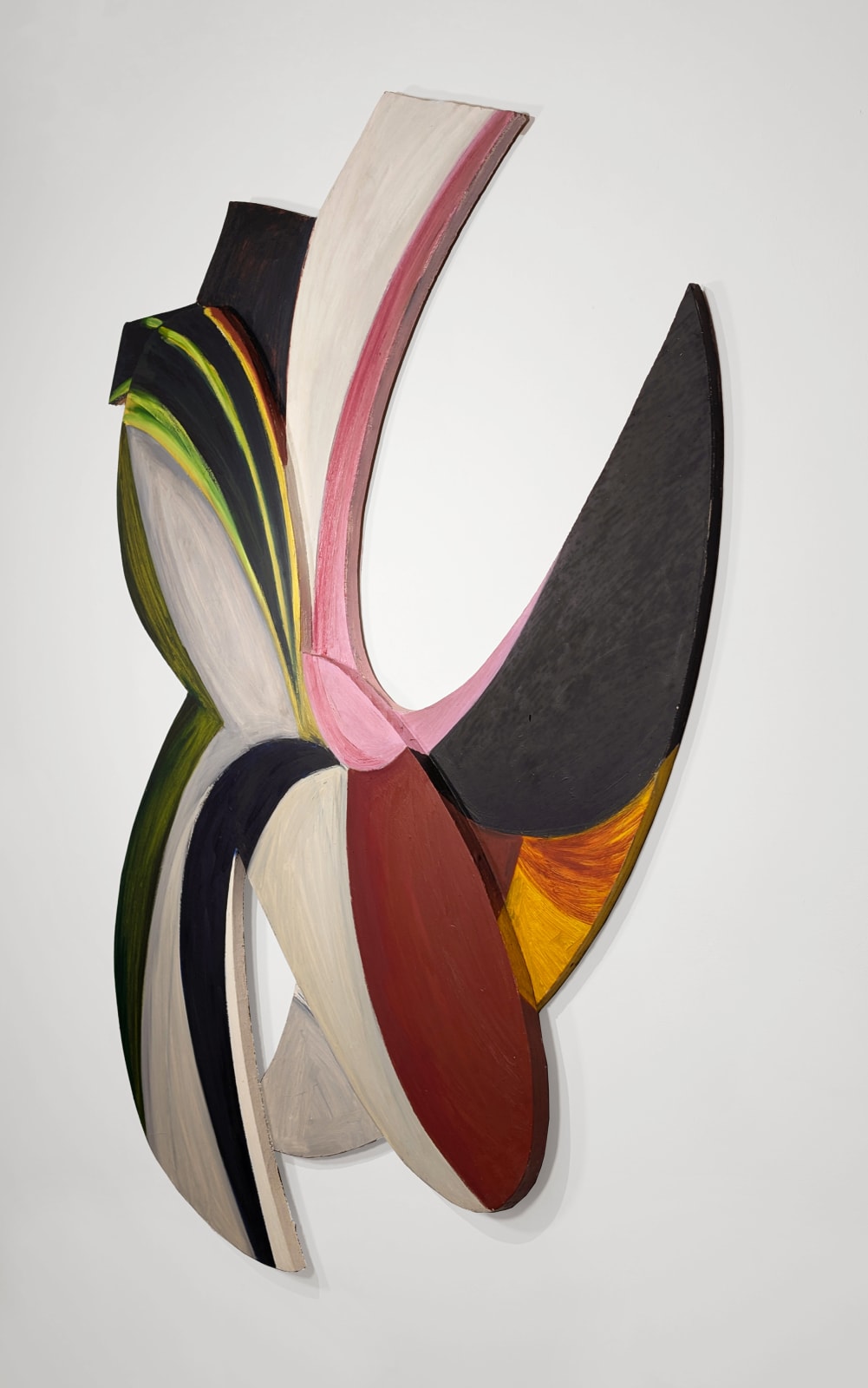 a colorful abstract painting on irregularly shaped wood panels assembled in a geometric formation with negative space hangs on a white wall