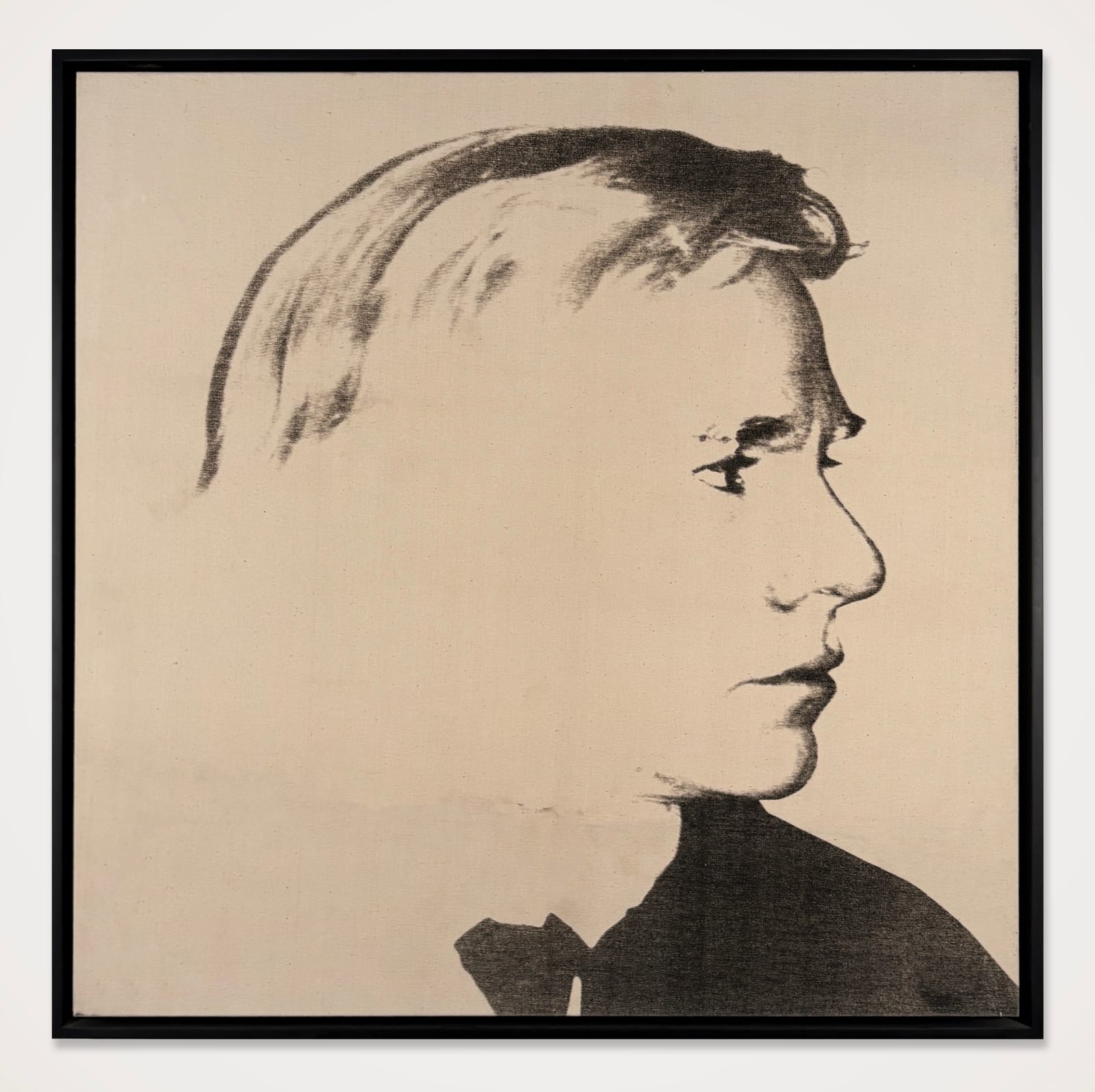 Framed monochromatic screenprint of Andy Warhol in high contrast and in profile