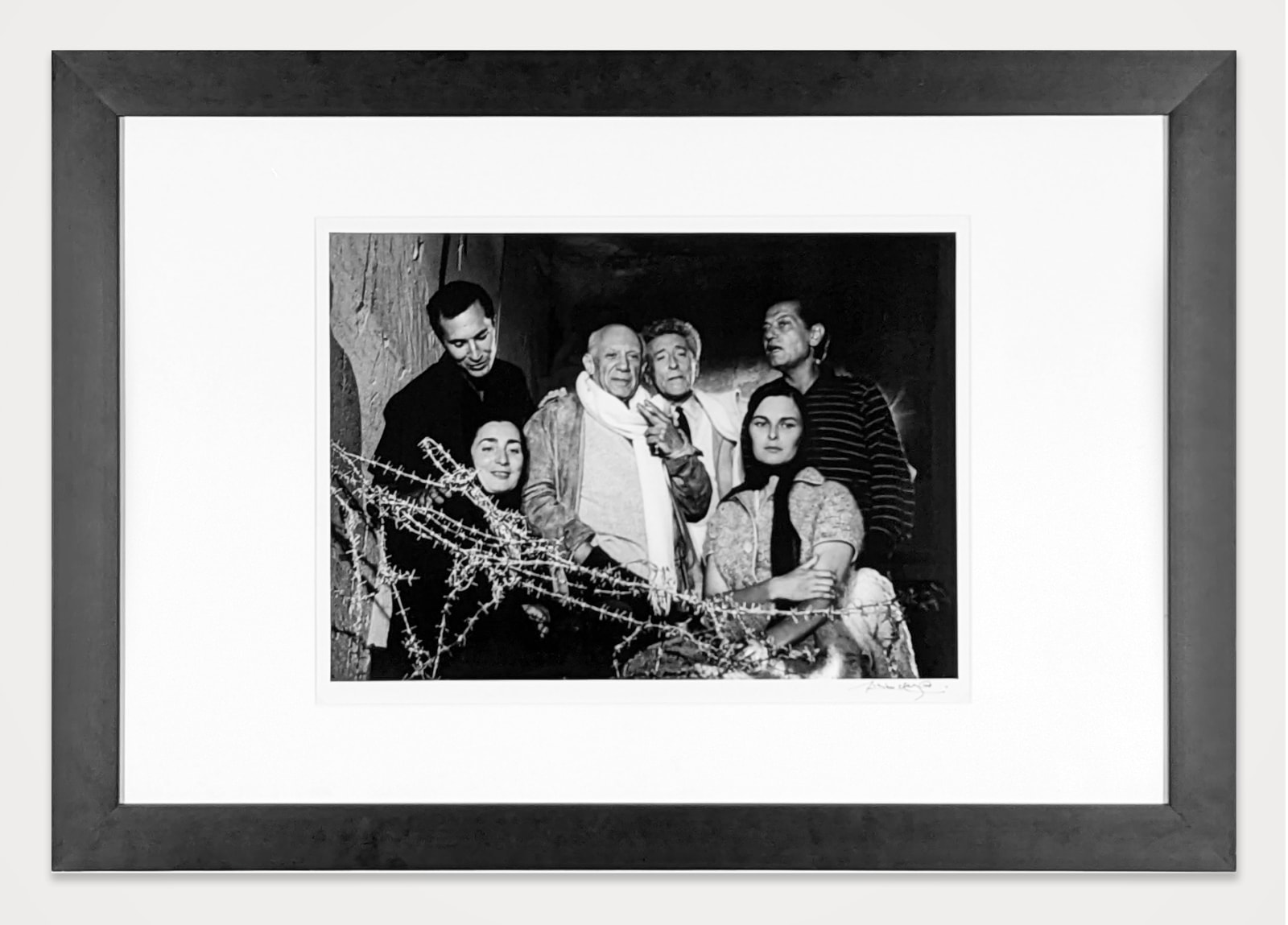 Framed black and white photograph of the Varykino estate,a large building with icicles and horses surrounding the estate, on the set of “Doctor Zhivago