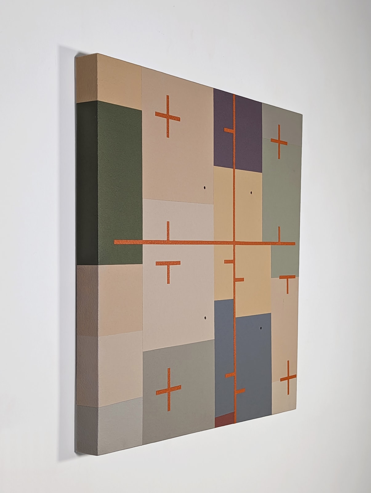 Quadrilateral shaped arcylic painting divided into irregular rectangular parcels of muted yellows, greens, blue, and purple with an overlaid orange coordinate plane