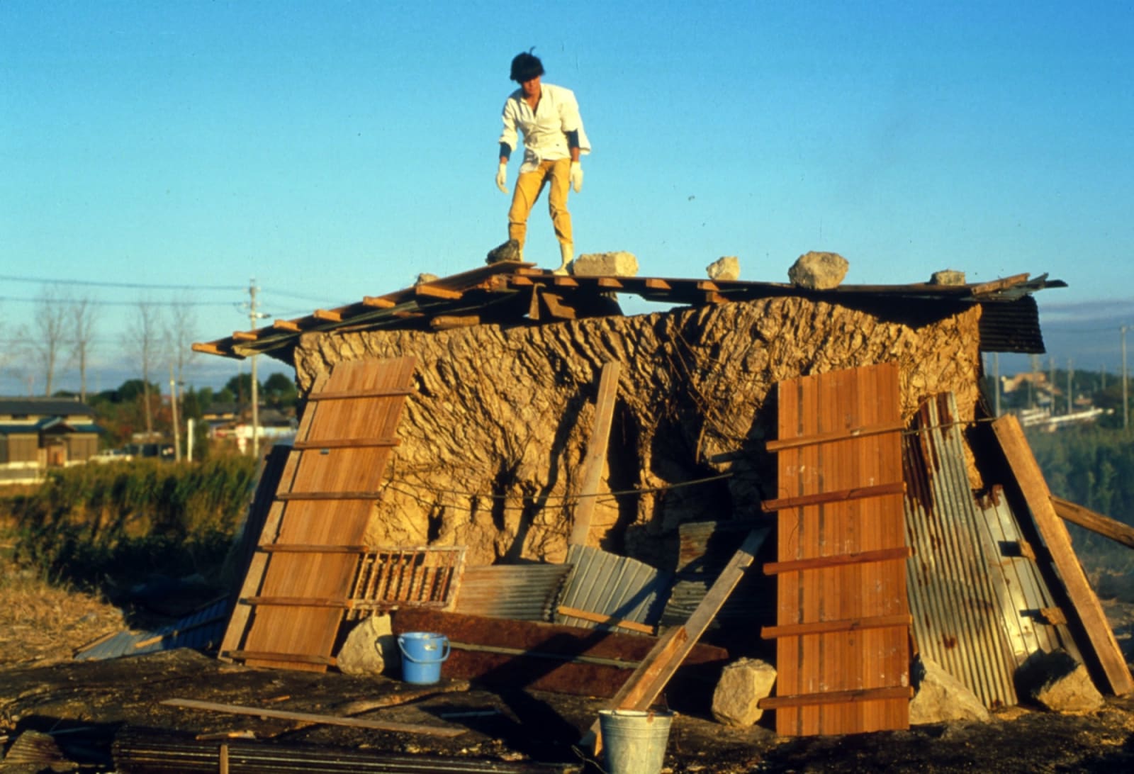 Nobuho Nagasawa on top of a roof looking down