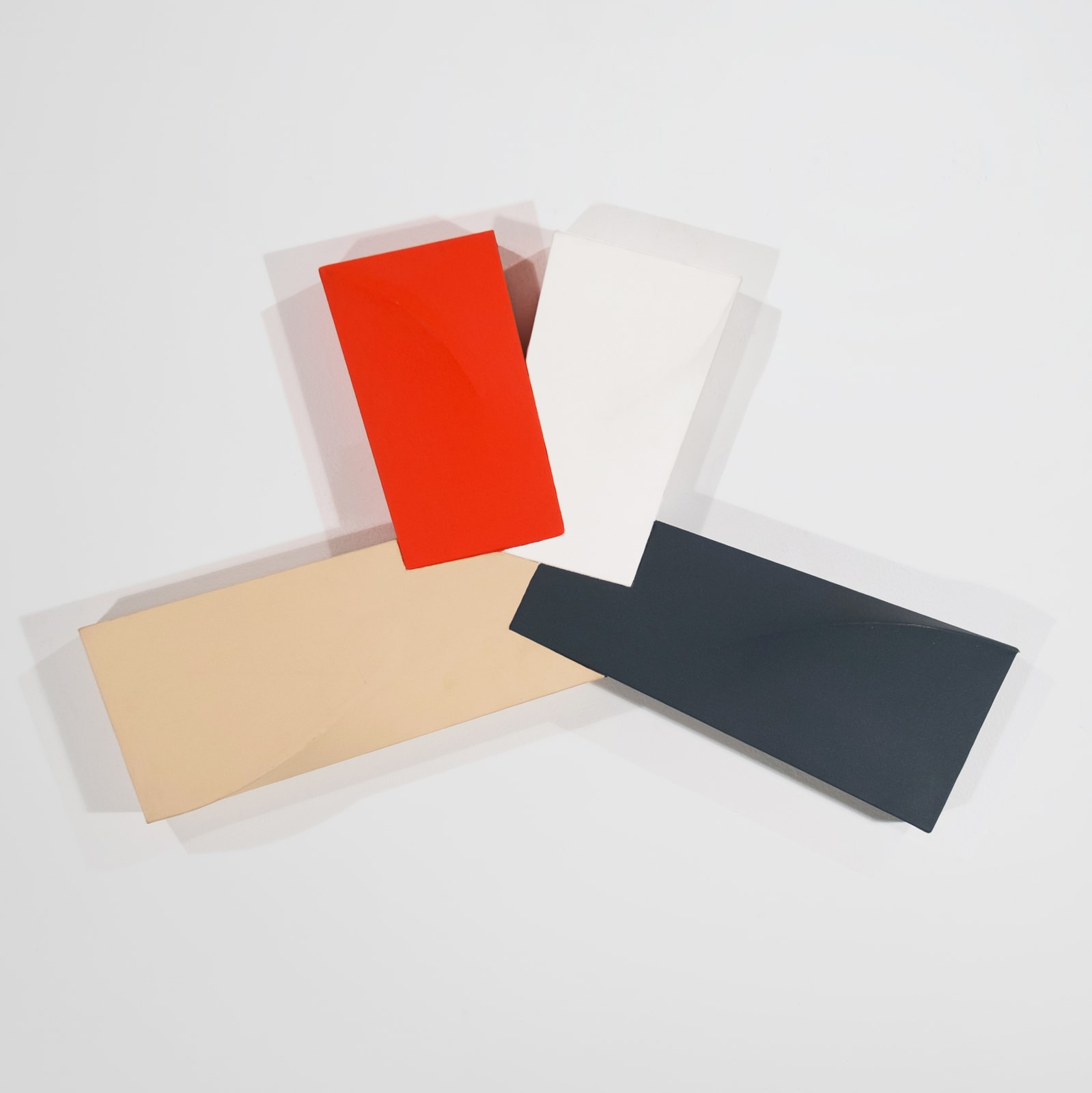 Painting of 4 interconnected tridimensional rectangles (beige, vermillion, white, black)