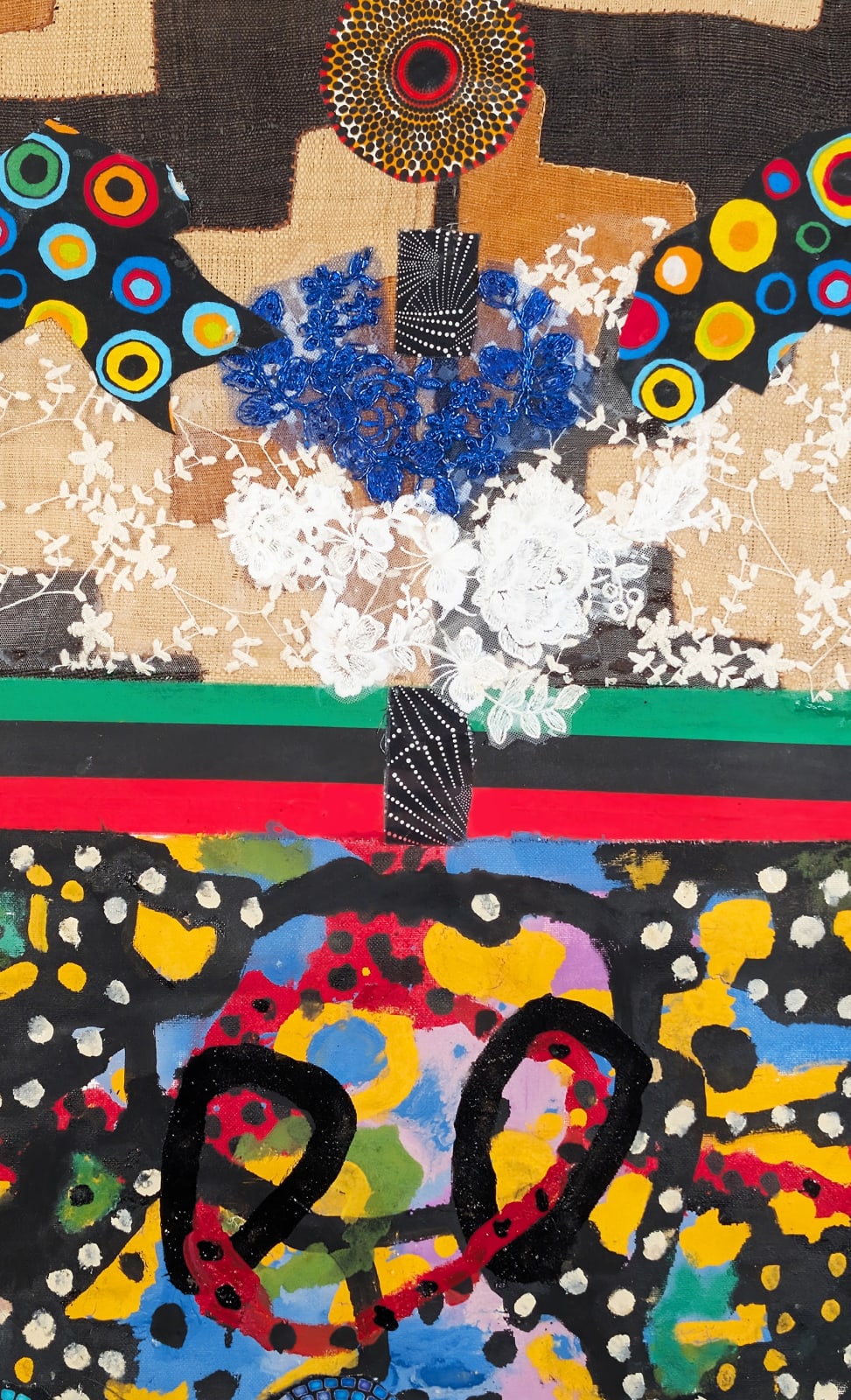 Detail of a colorful artwork comprised of oil and patterned fabric on canvas in a