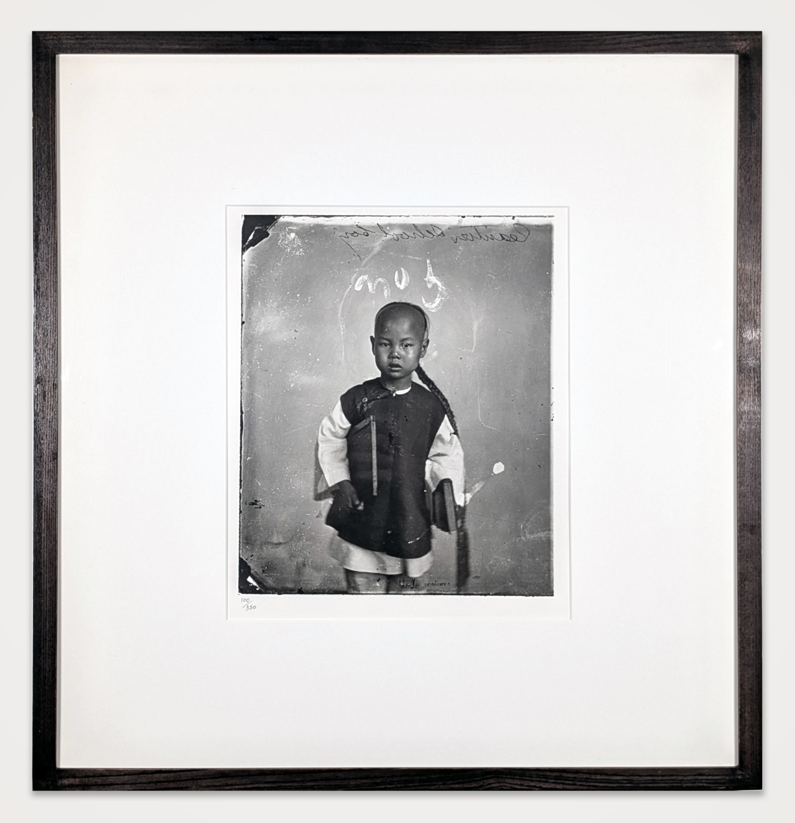 Framed black and white vintage photograph of a young boy in Guangzhou, China