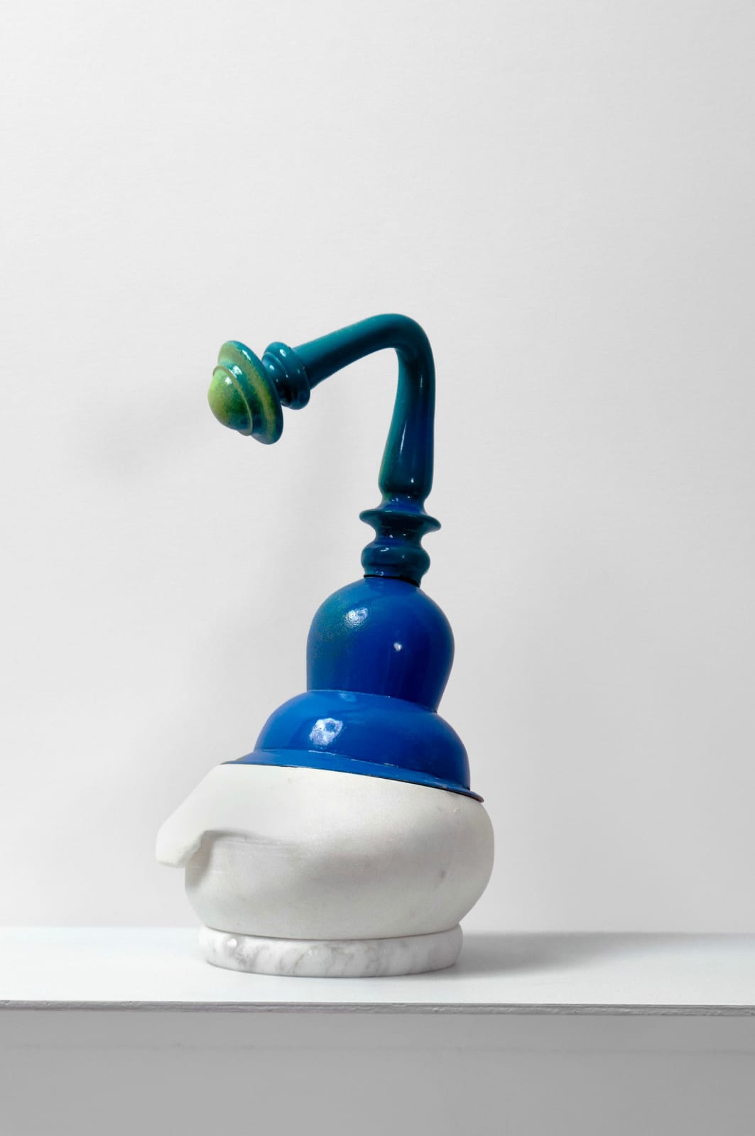 Contemporary minimalist sculpture made of stone and metal that resembles an ambiguous artifact