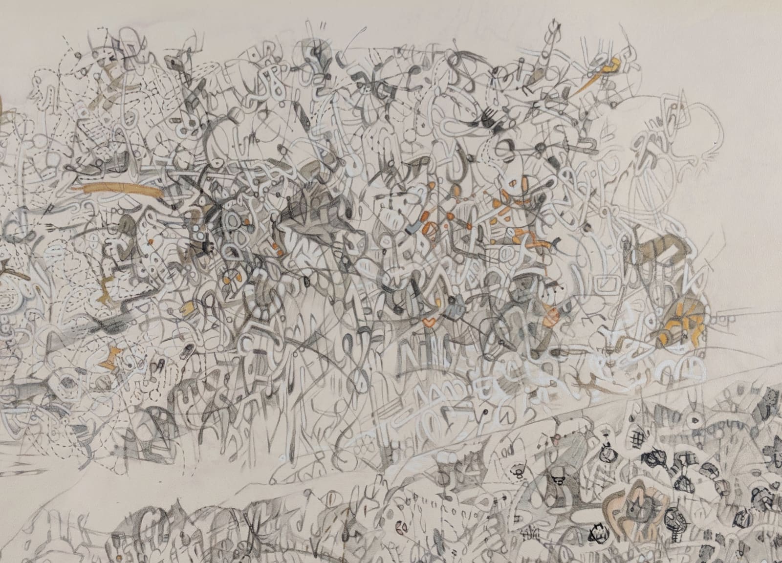Detail of an abstract painting in gray, black, and yellow forming a cluster of forms and lines in a circle, painted on a natural piece of beige leather