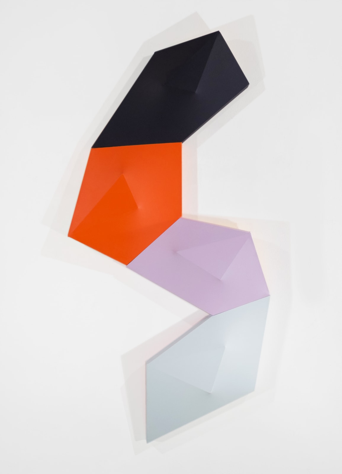 Tridimensional painting of 4 connected prisms with a triangle tops in black, orange, lavender, and white
